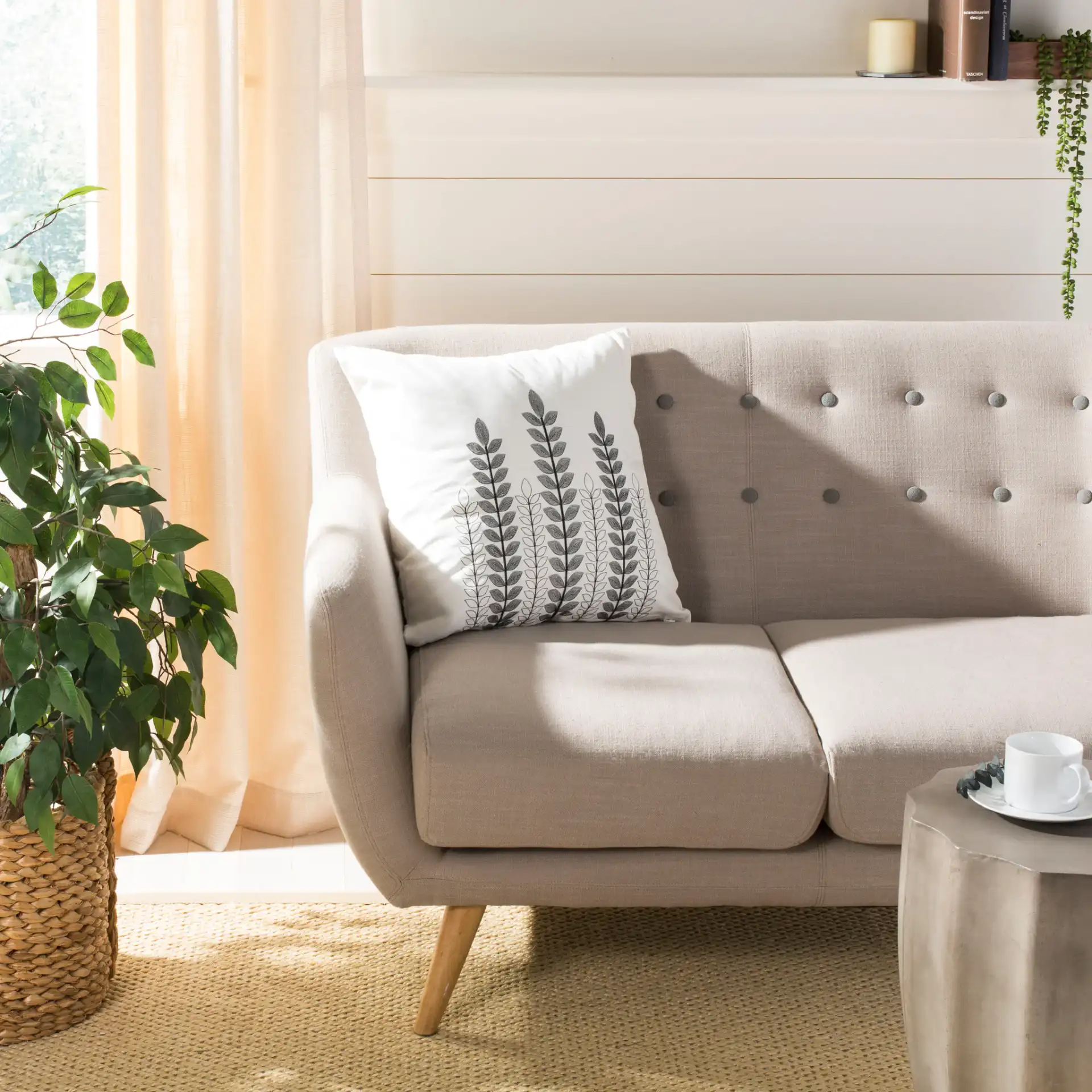 Valorie Vine Pillow in White / Gray in a styled room