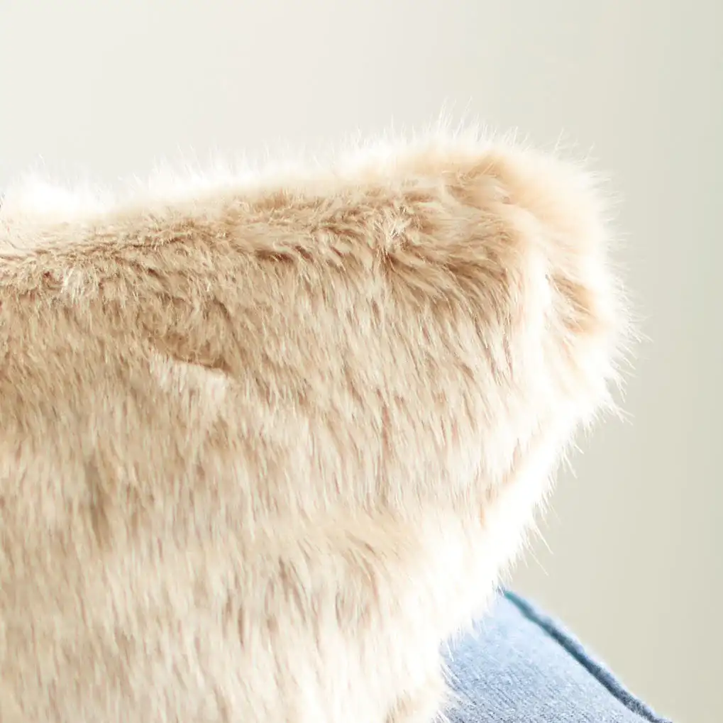 Adanna Fur Pillow in Brown in a styled room