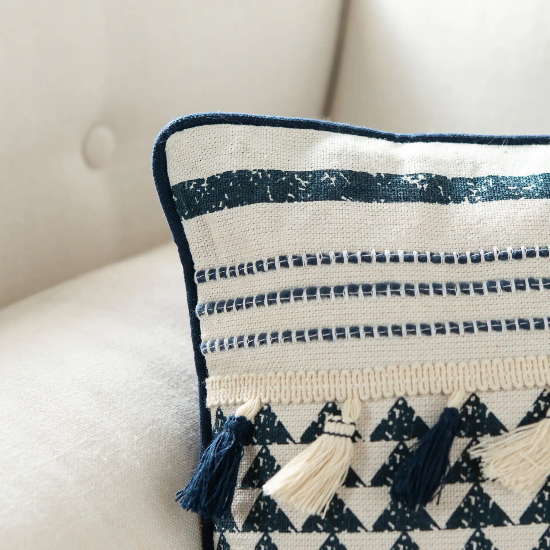 Enya Pillow in Cream / Navy in a styled room