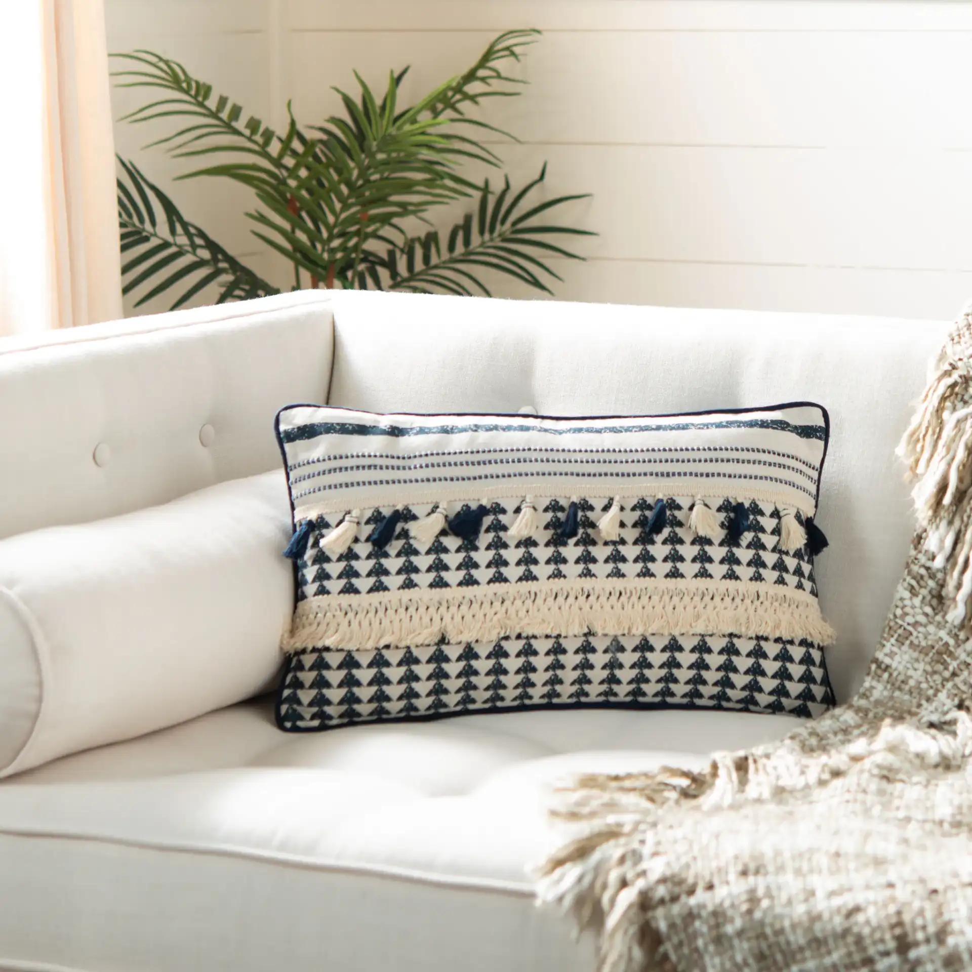 Enya Pillow in Cream / Navy in a styled room