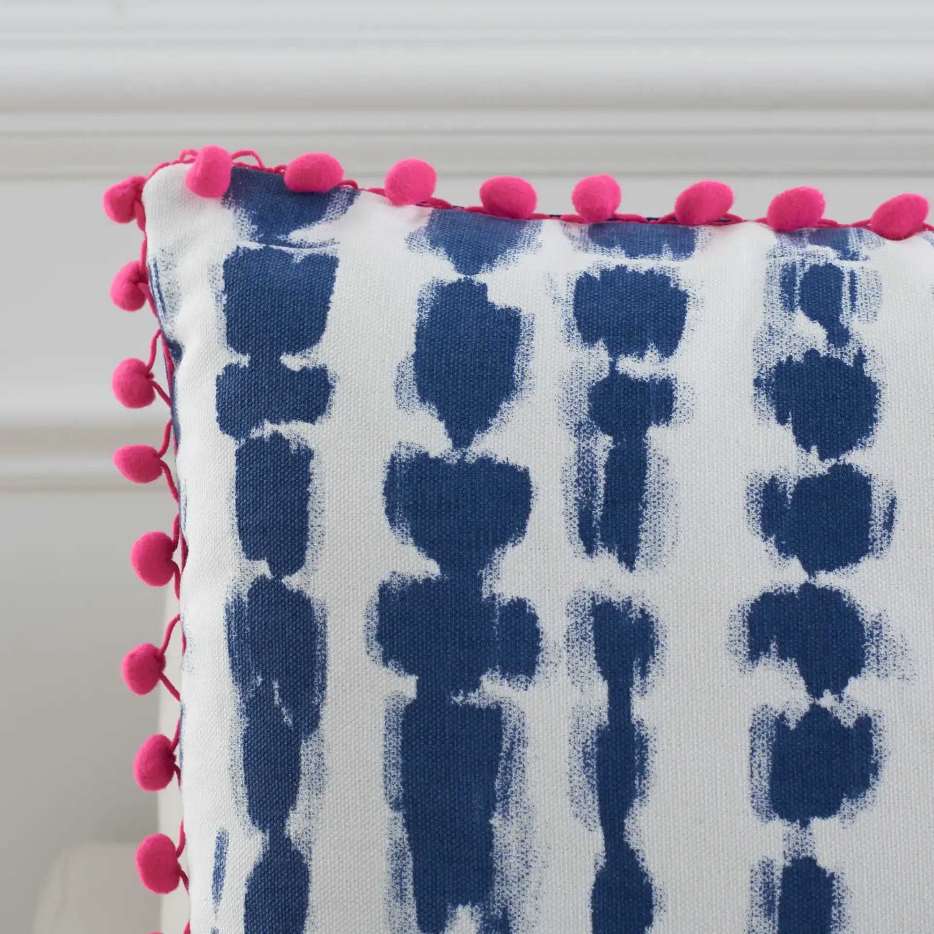 Atalia Pillow in Pink / Cream / Navy in a styled room