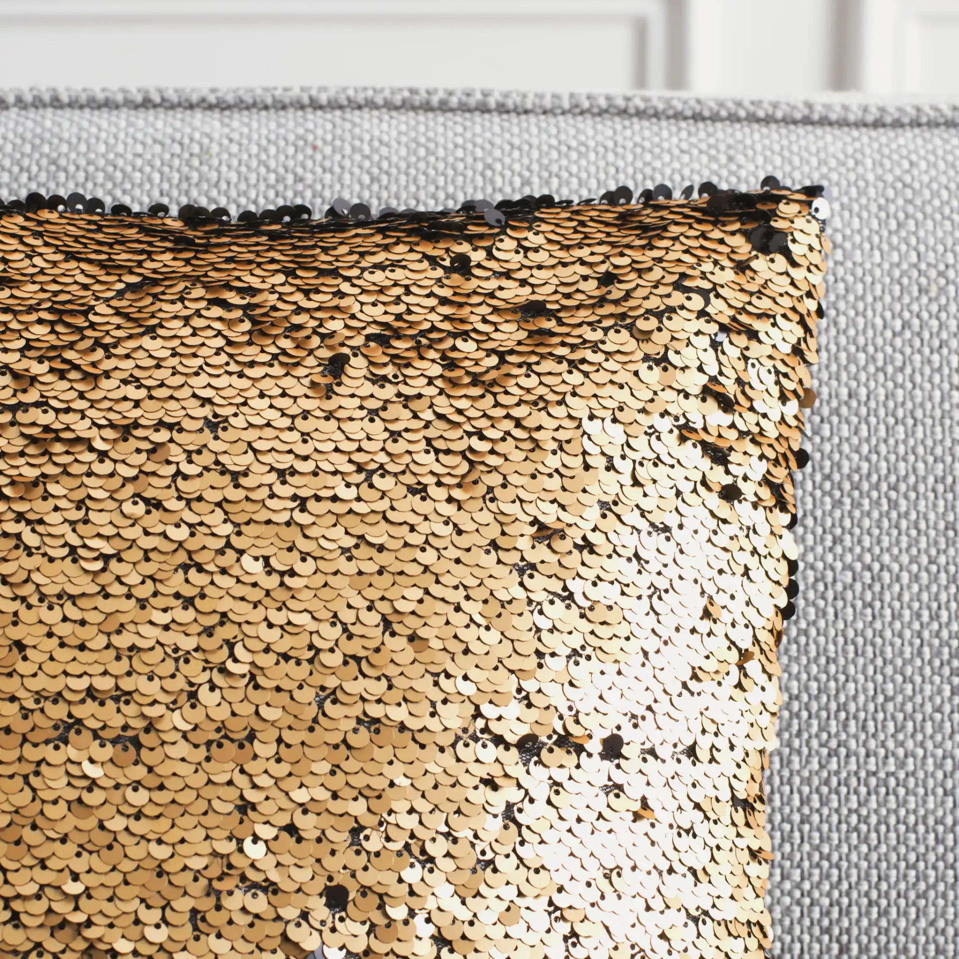 Talon Two-Tone Pillow in Gold in a styled room