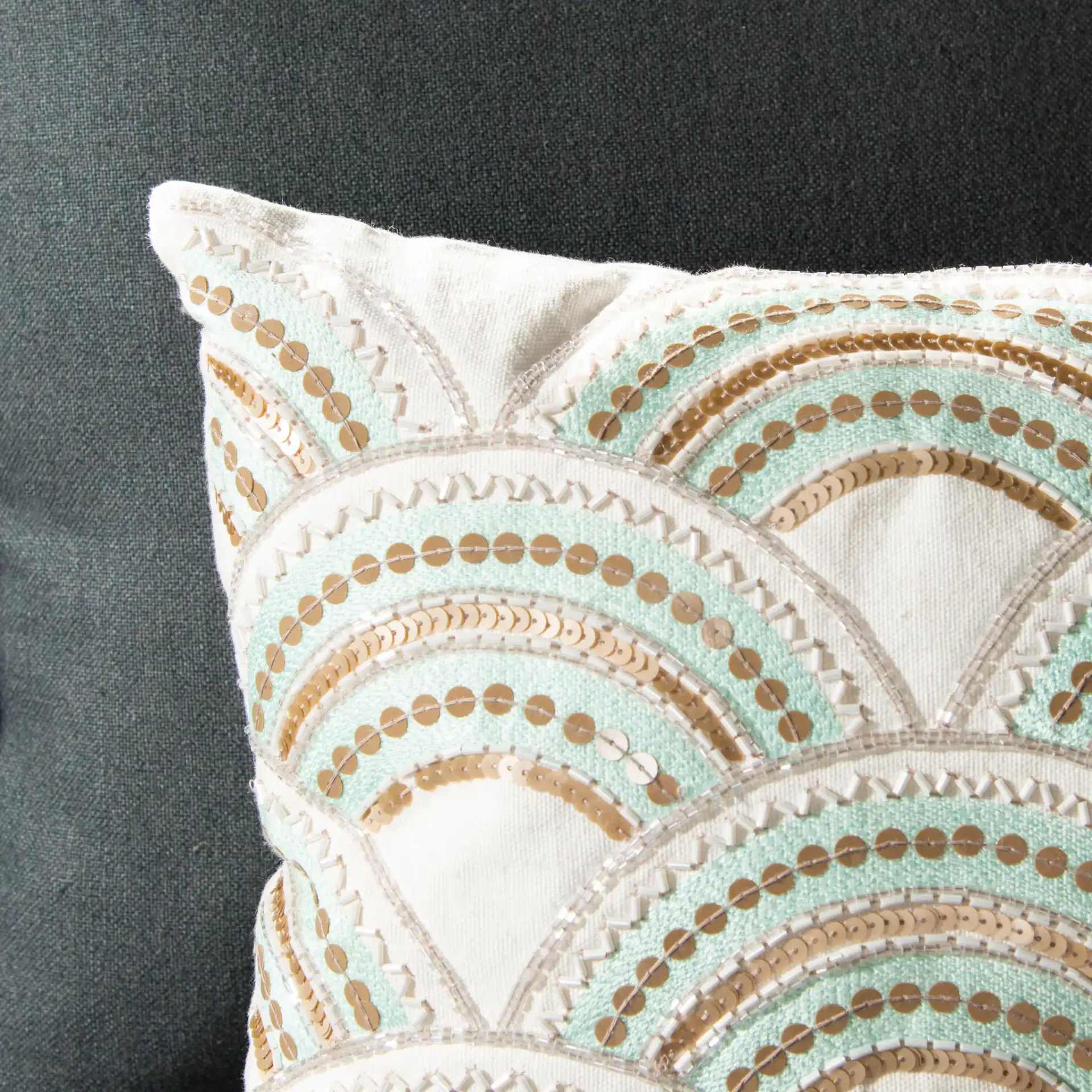Kadri Pillow in Beige / Teal / Gold in a styled room