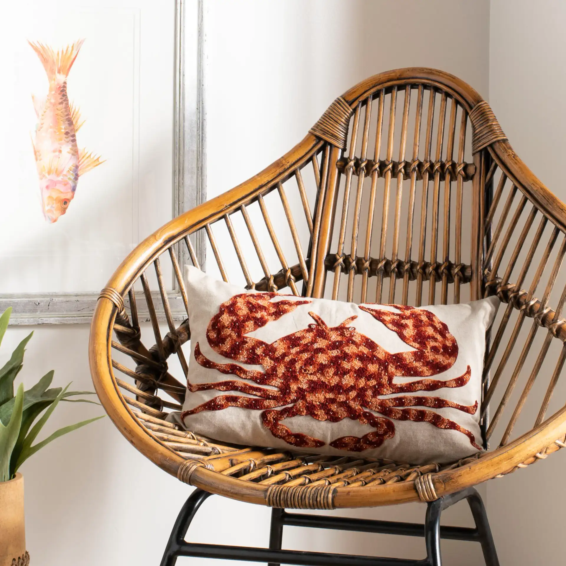 Lilia Pillow in Beige / Red / Orange in a styled room
