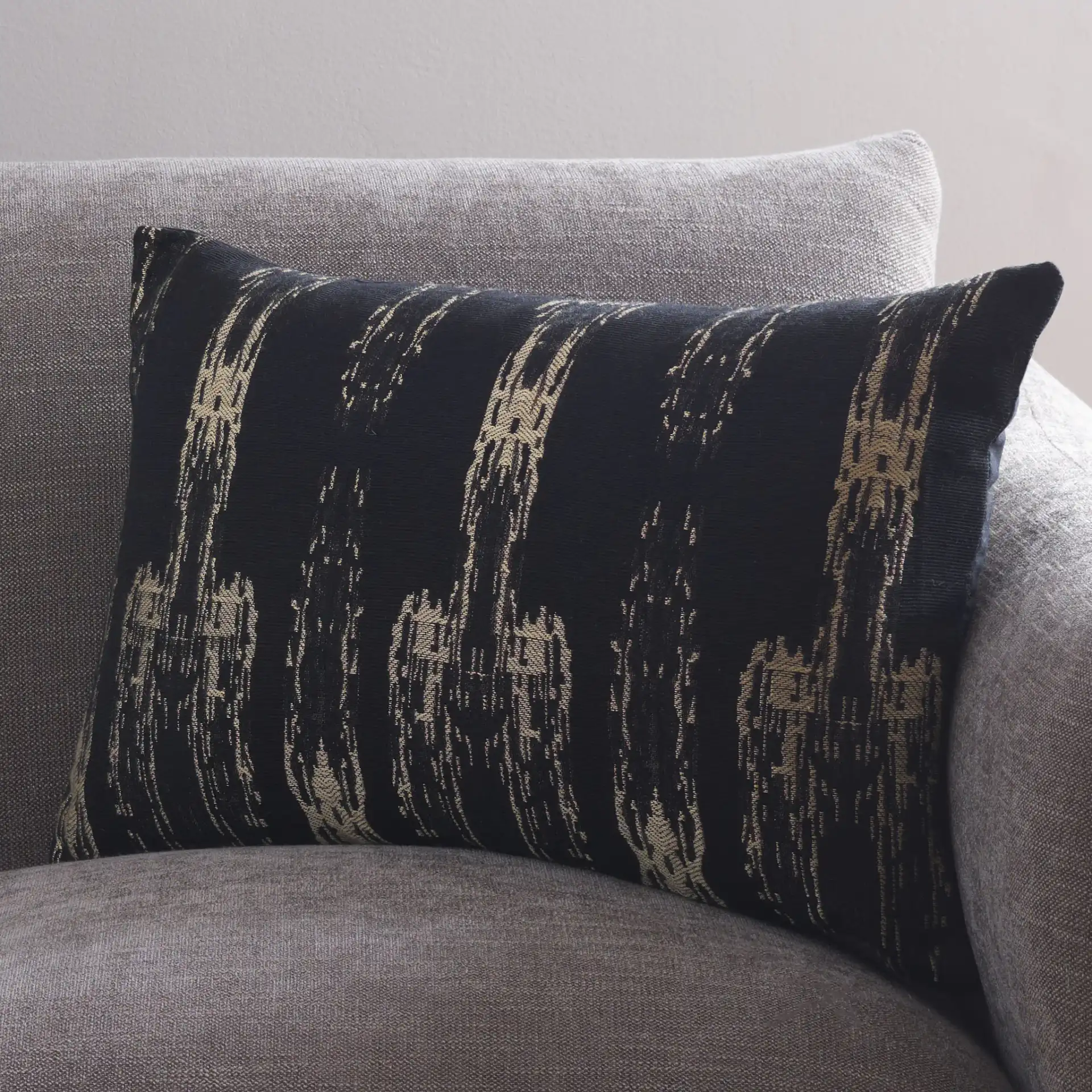 Zoelle Pillow in Black / Natural in a styled room