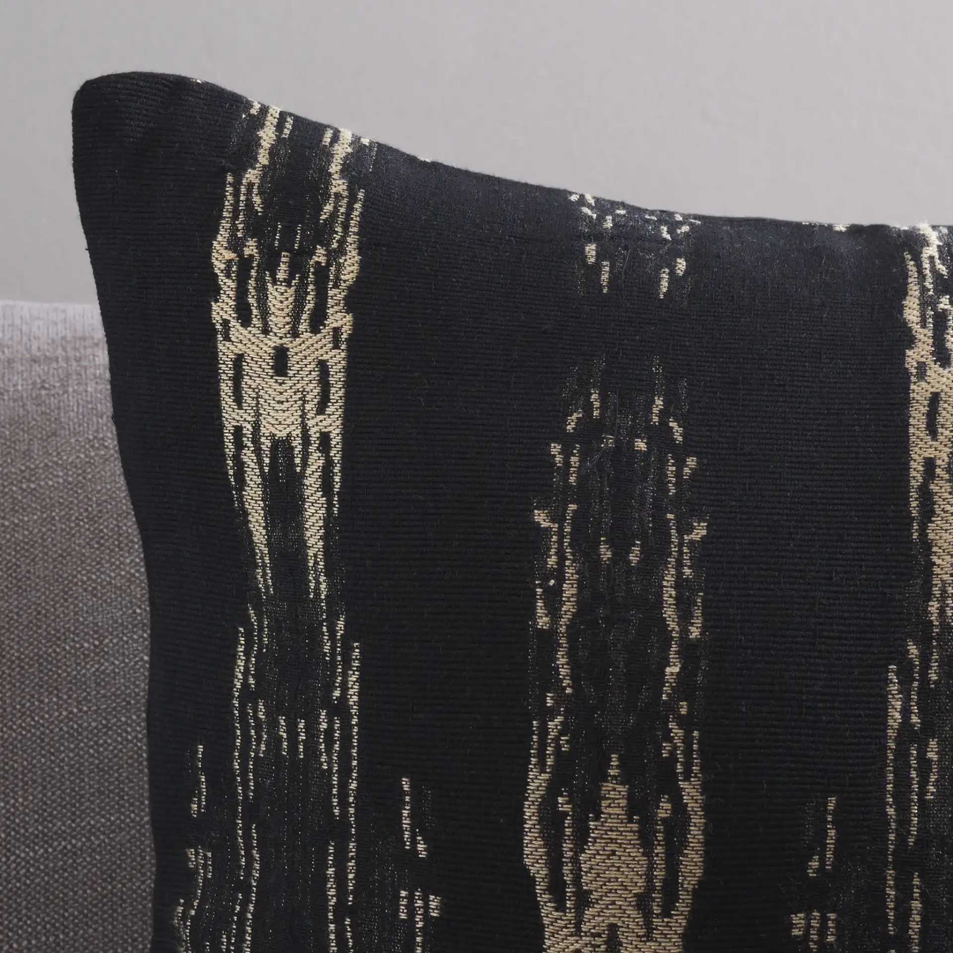 Zoelle Pillow in Black / Natural in a styled room