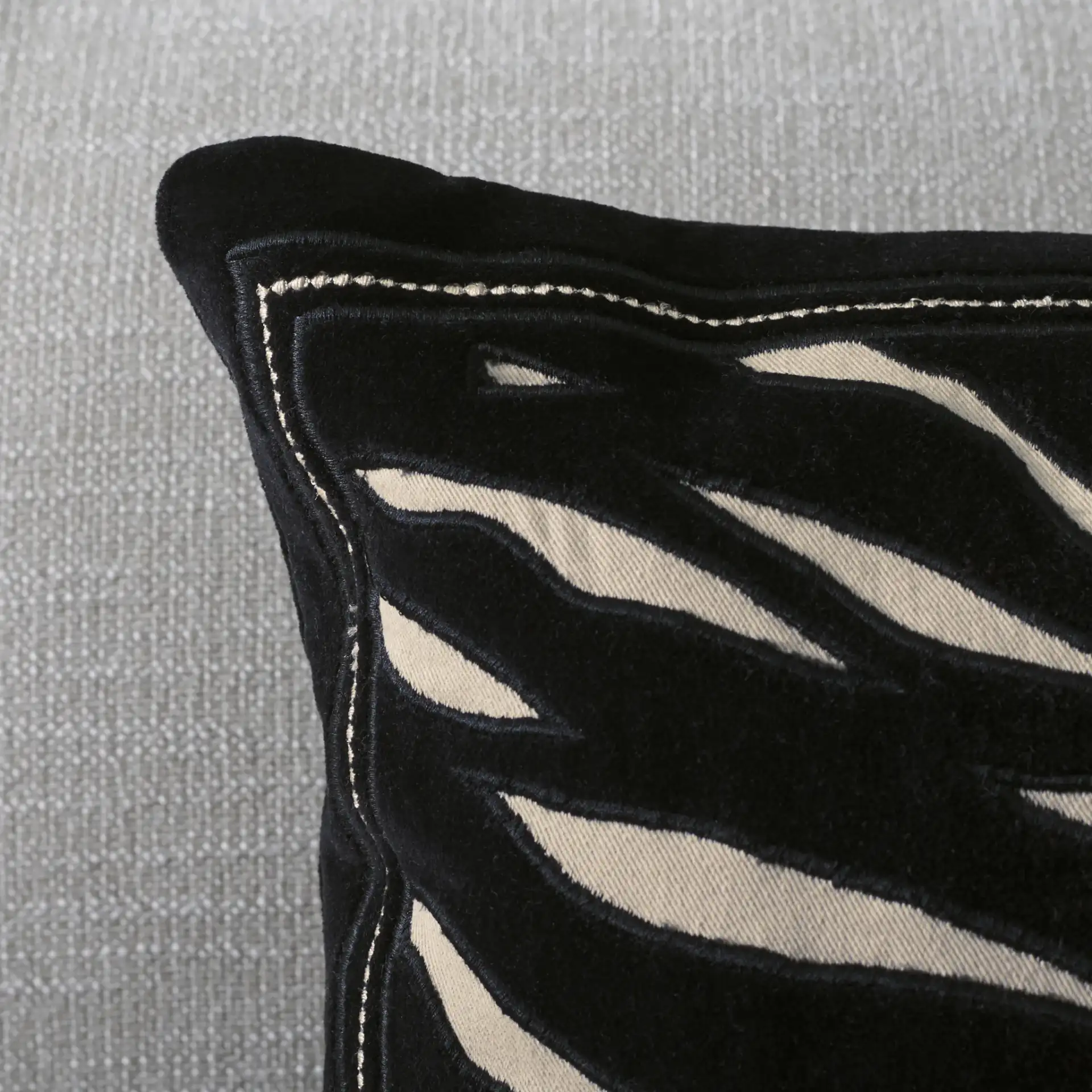 Rhea Pillow in Black / Ivory in a styled room