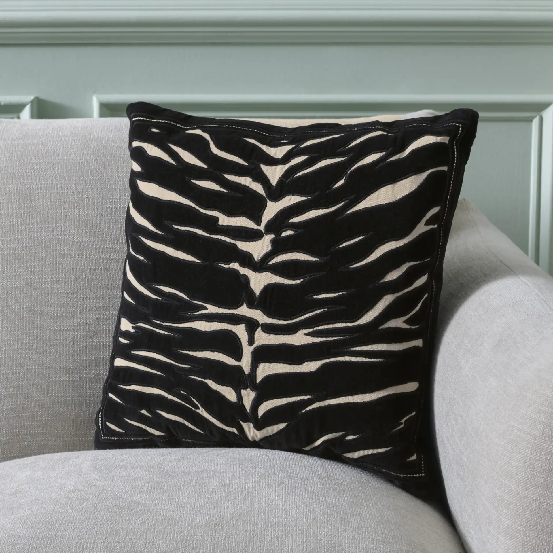 Rhea Pillow in Black / Ivory in a styled room