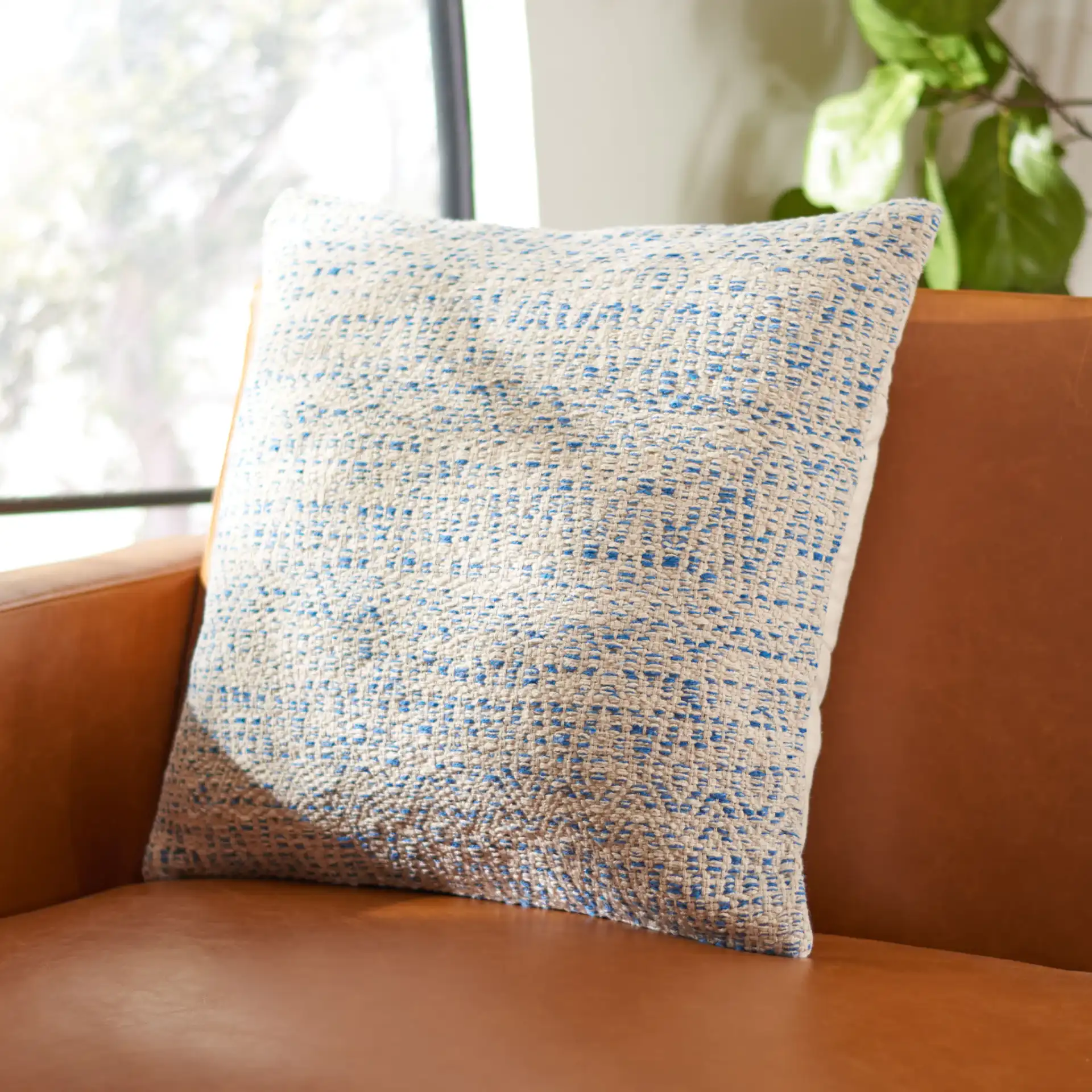 Parvati Pillow in Silver in a styled room