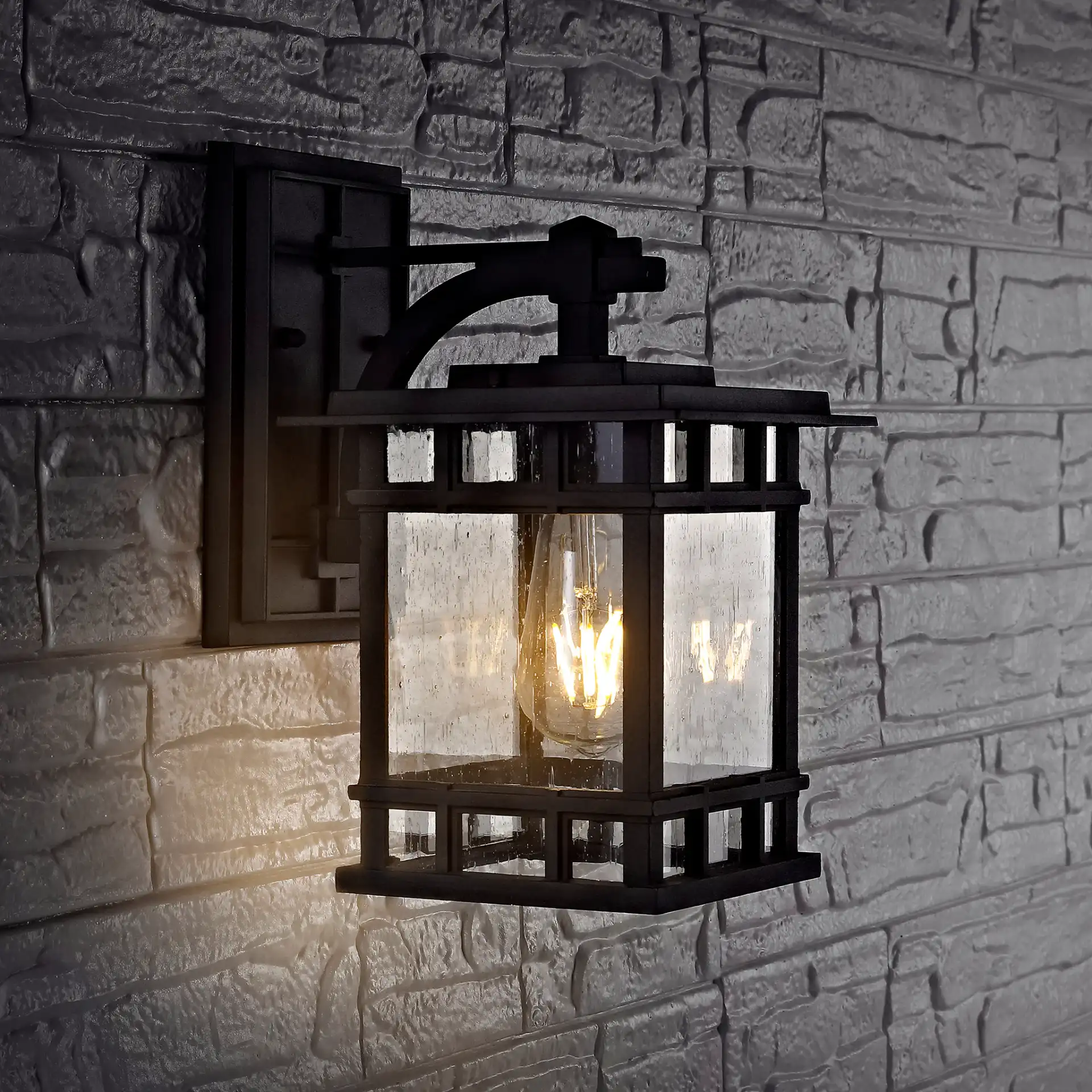 Grayter Outdoor Wall Lantern in Black in a styled room