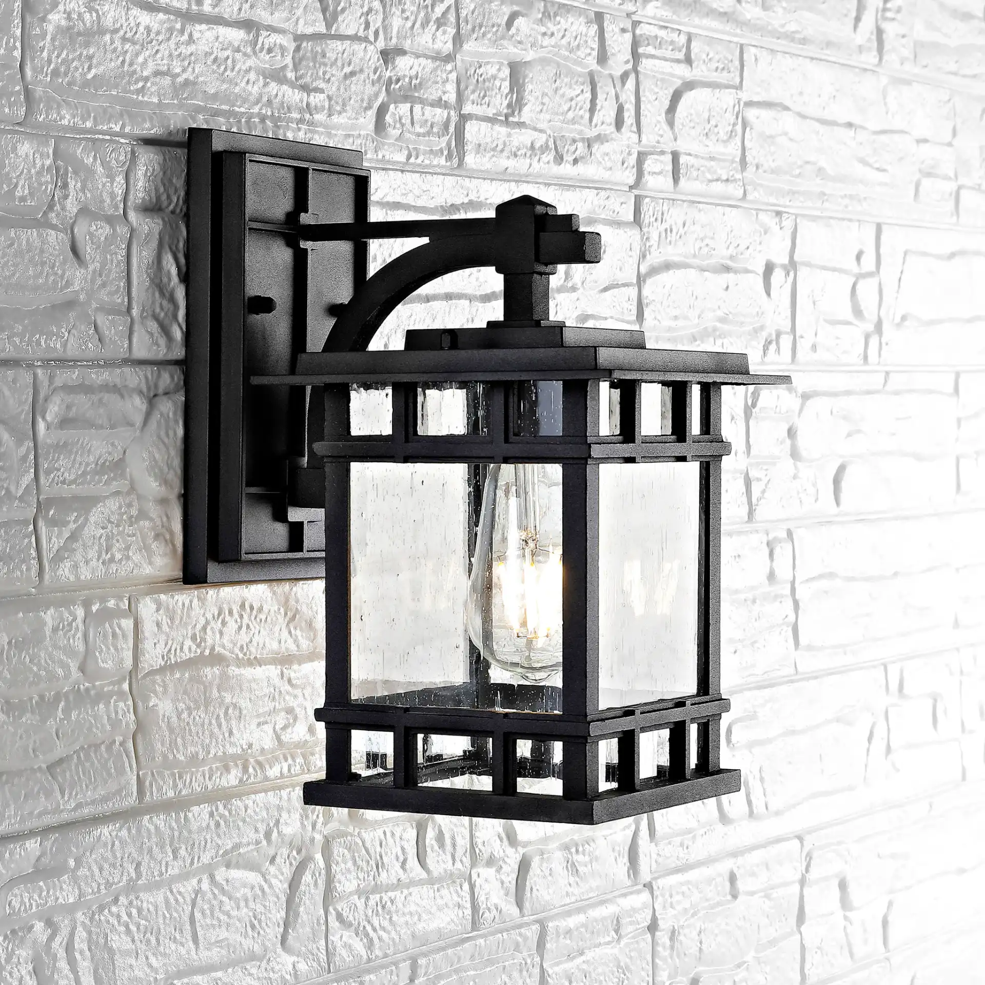 Grayter Outdoor Wall Lantern in Black in a styled room