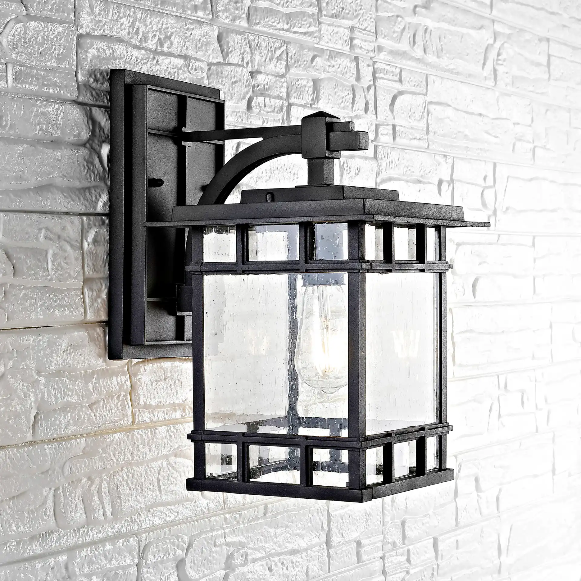 Rolran Outdoor Wall Lantern in Black in a styled room