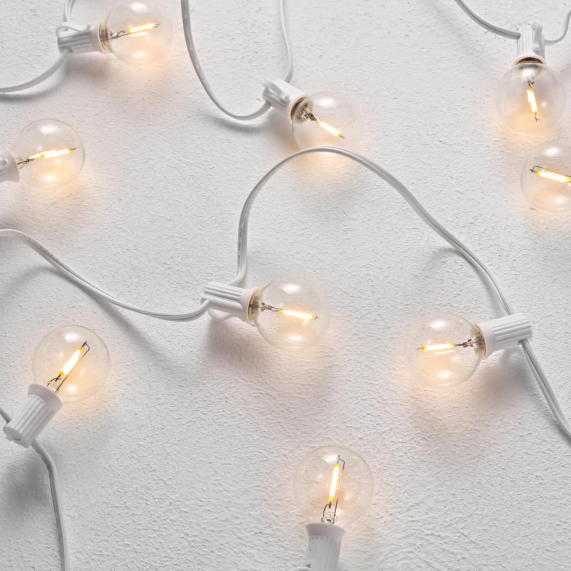 Chiera Led Outdoor String Lights in White in a styled room