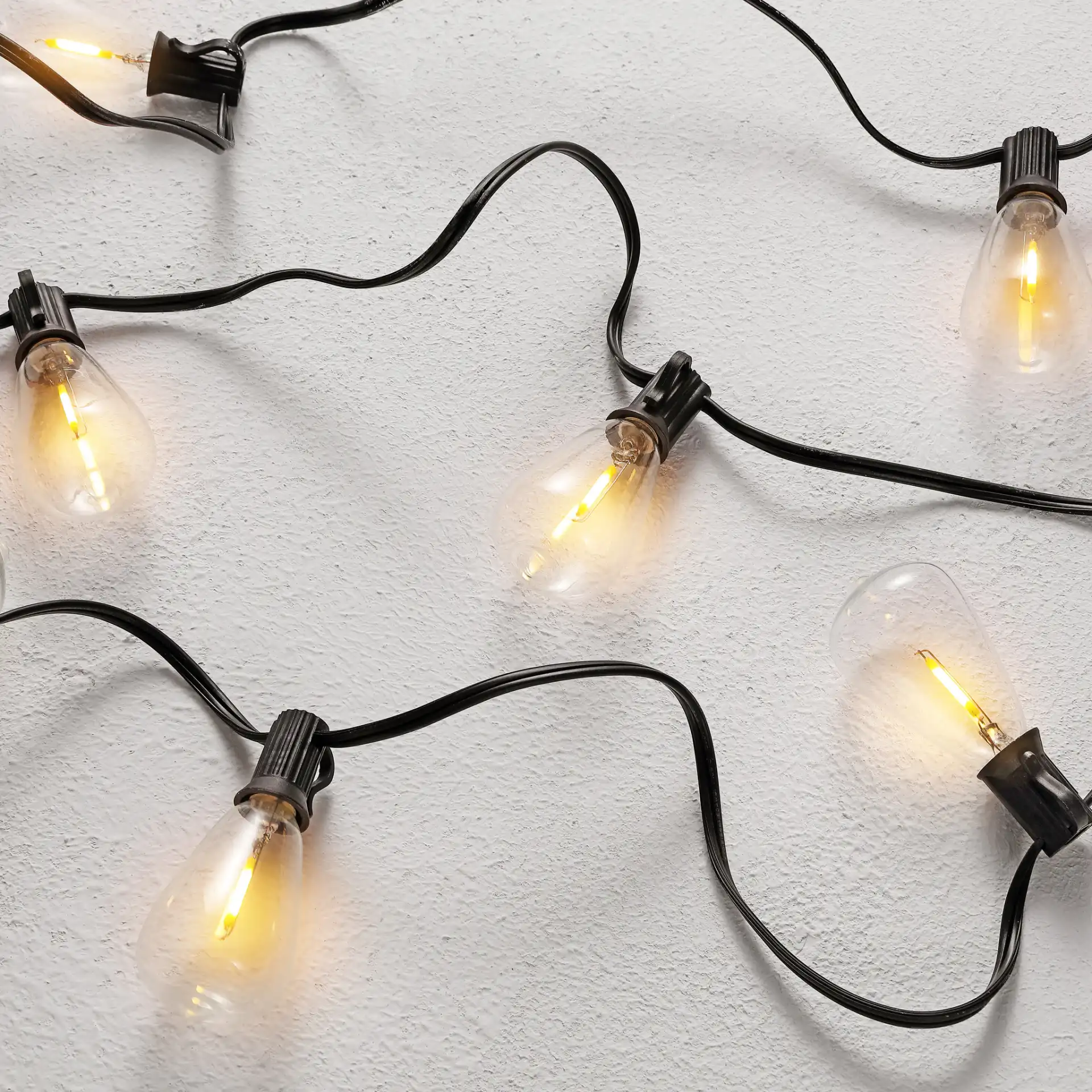 Dorcia Led Outdoor String Light in Black in a styled room
