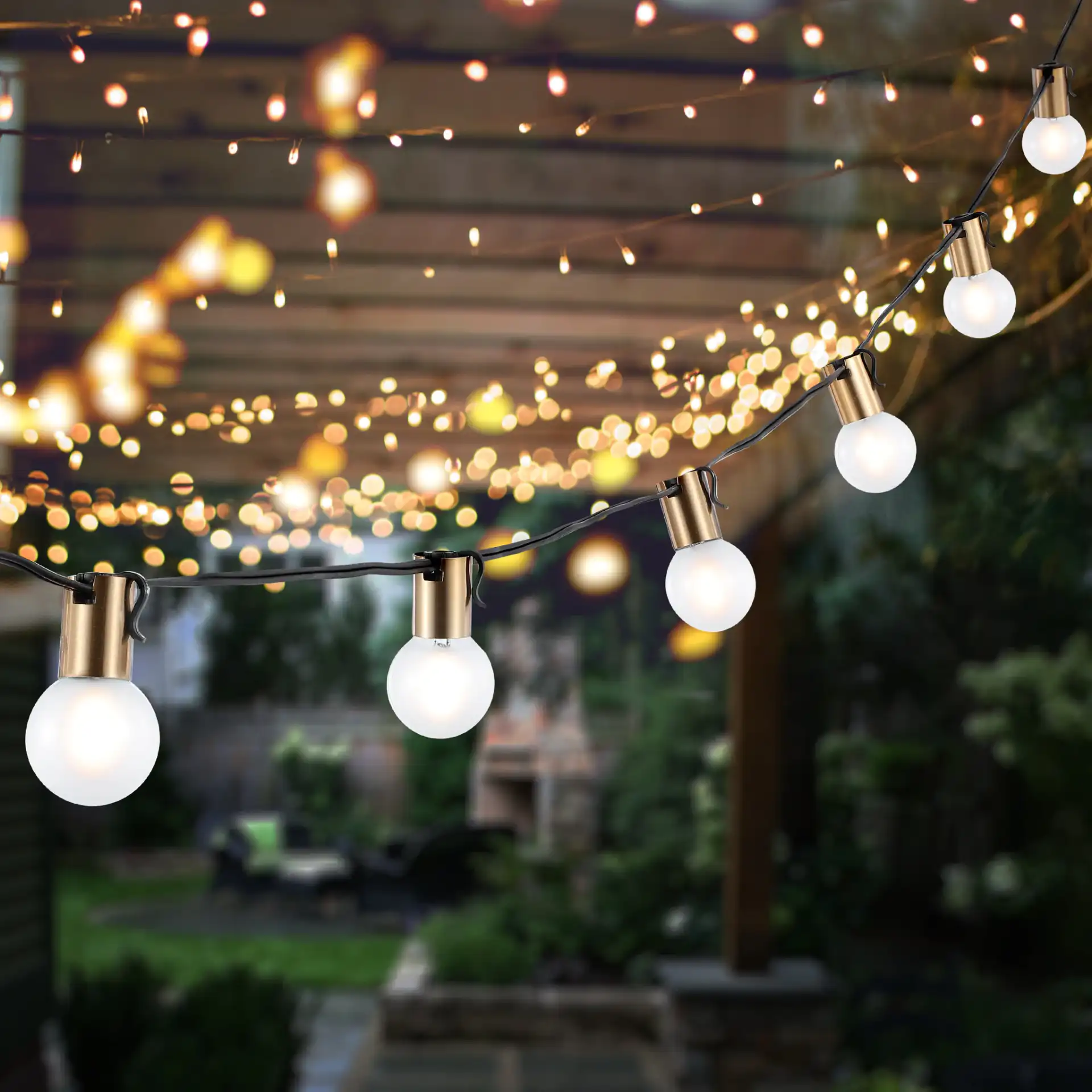 Farrynn Outdoor String Lights in Brass / Black in a styled room