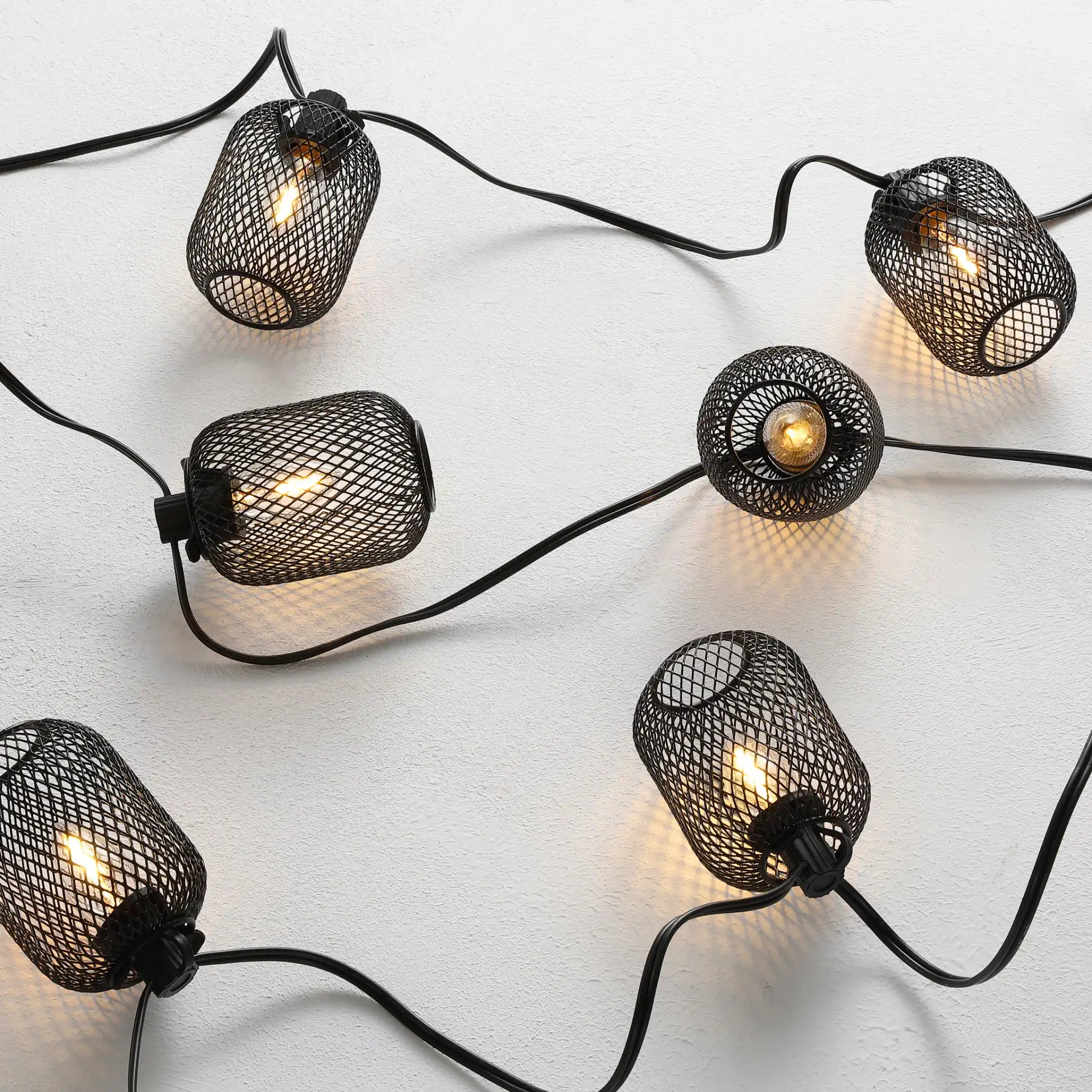 Jepsen Led Outdoor String Light in Black in a styled room