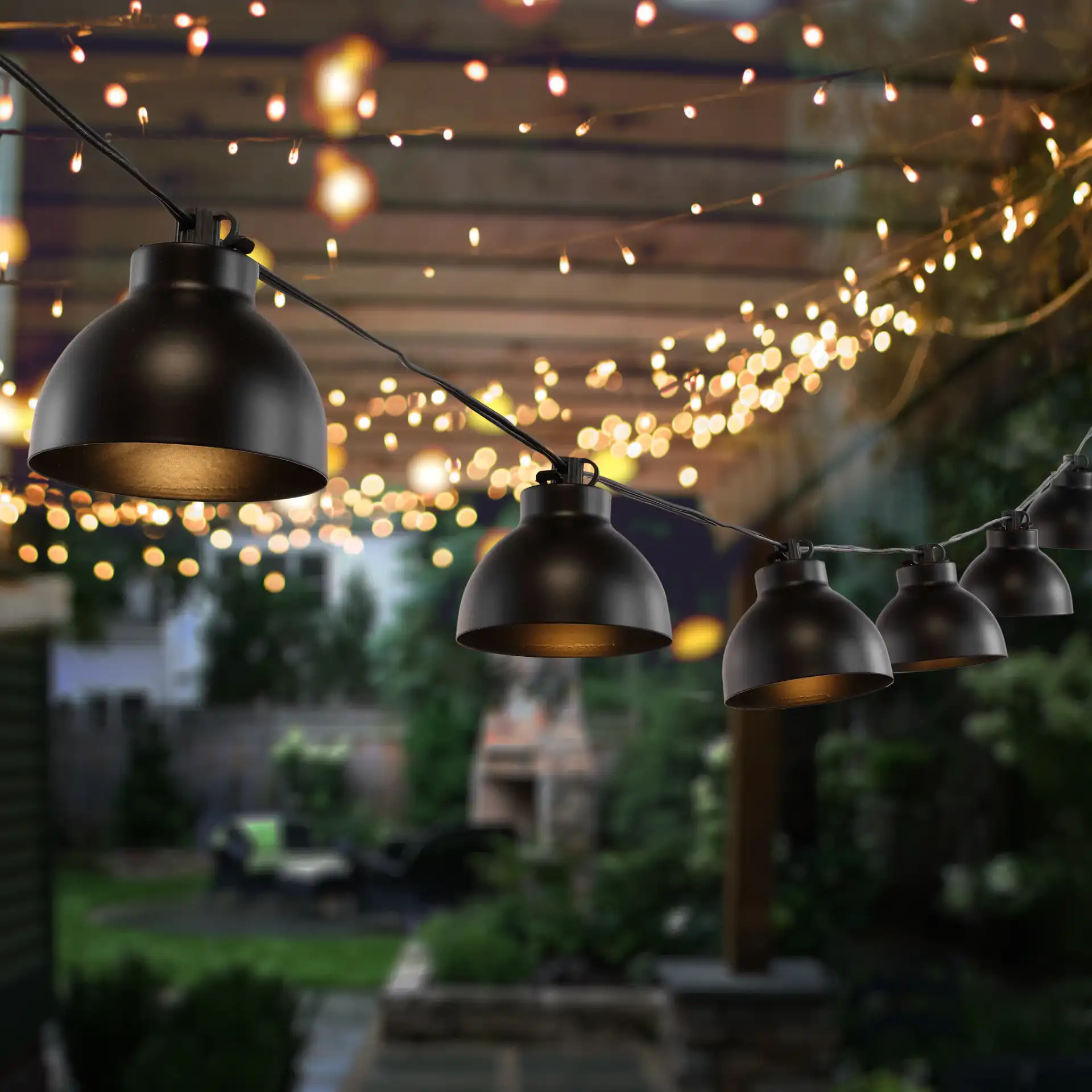Claudie Led Outdoor String Light in Black in a styled room