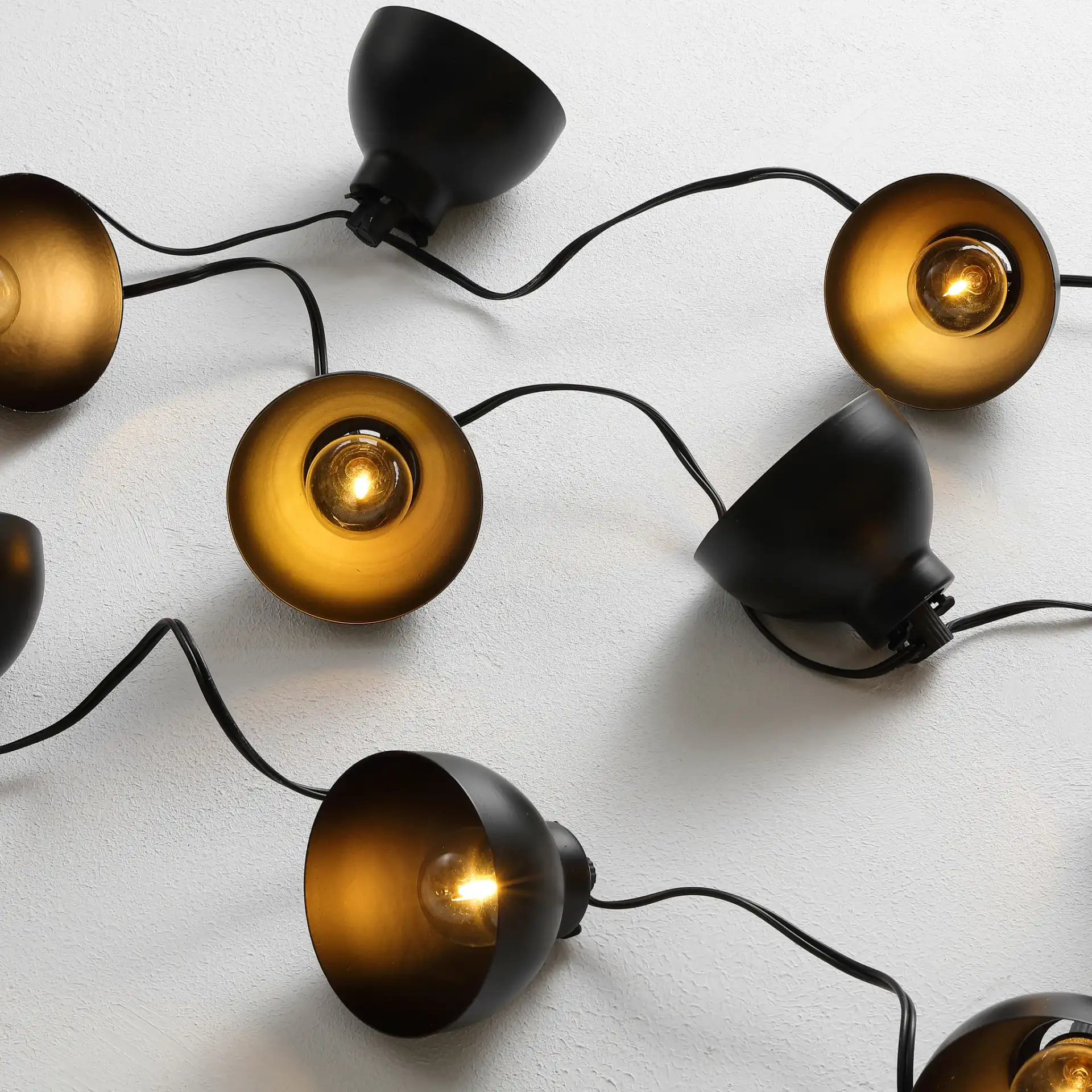 Claudie Led Outdoor String Light in Black in a styled room
