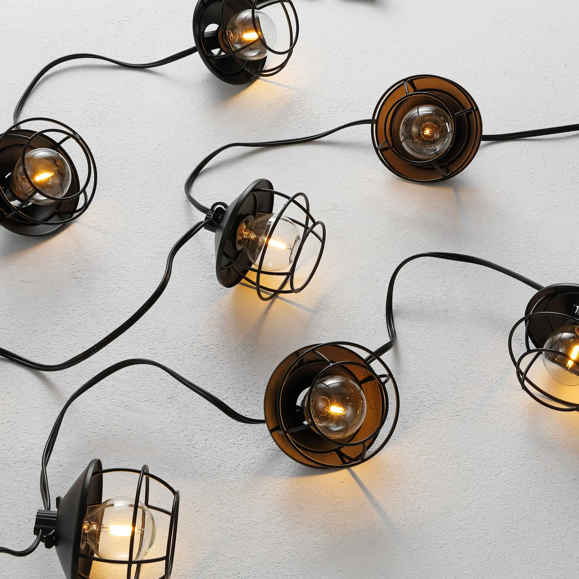 Agitha Led Outdoor String Light in Black in a styled room
