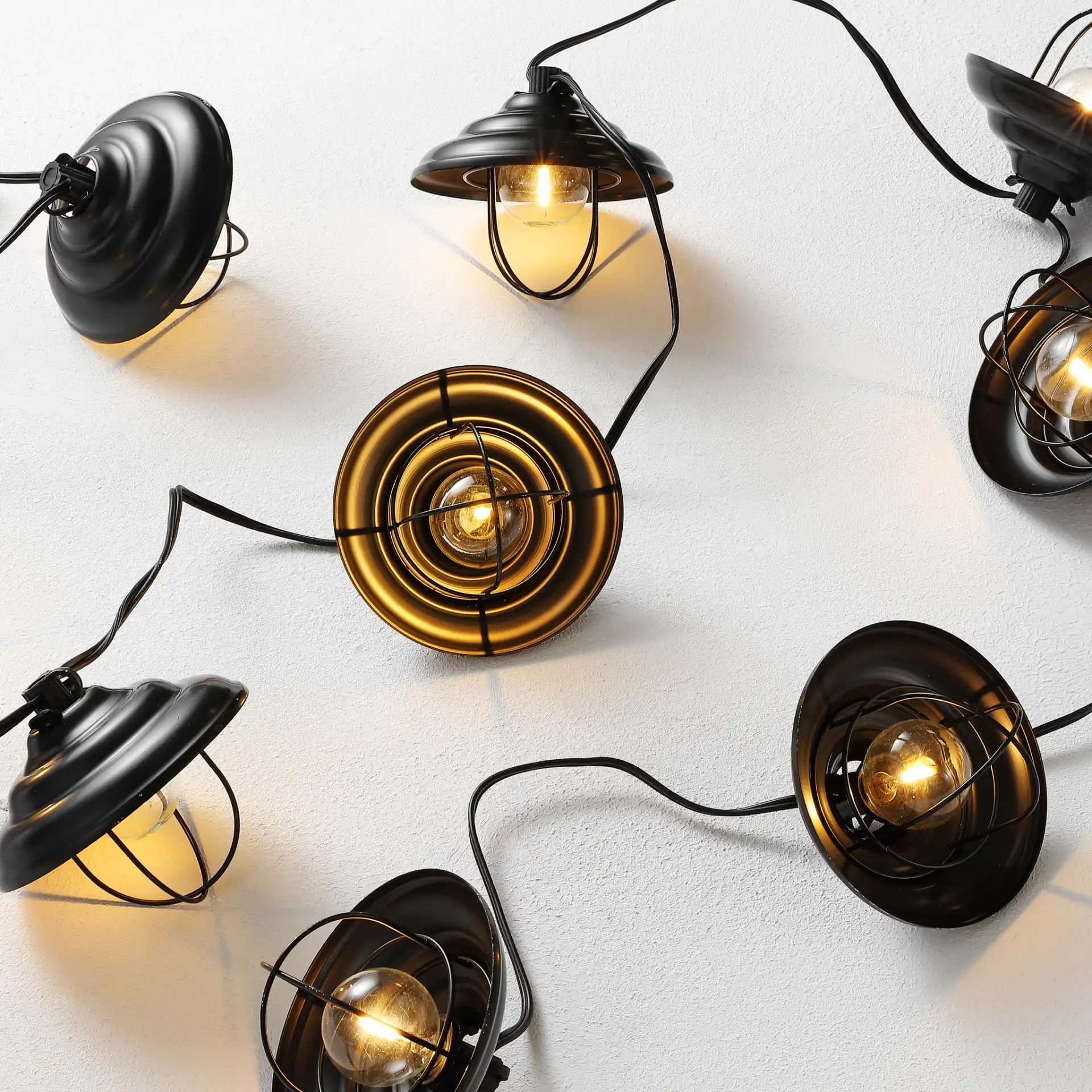 Aislin Led Outdoor String Lights in Black in a styled room