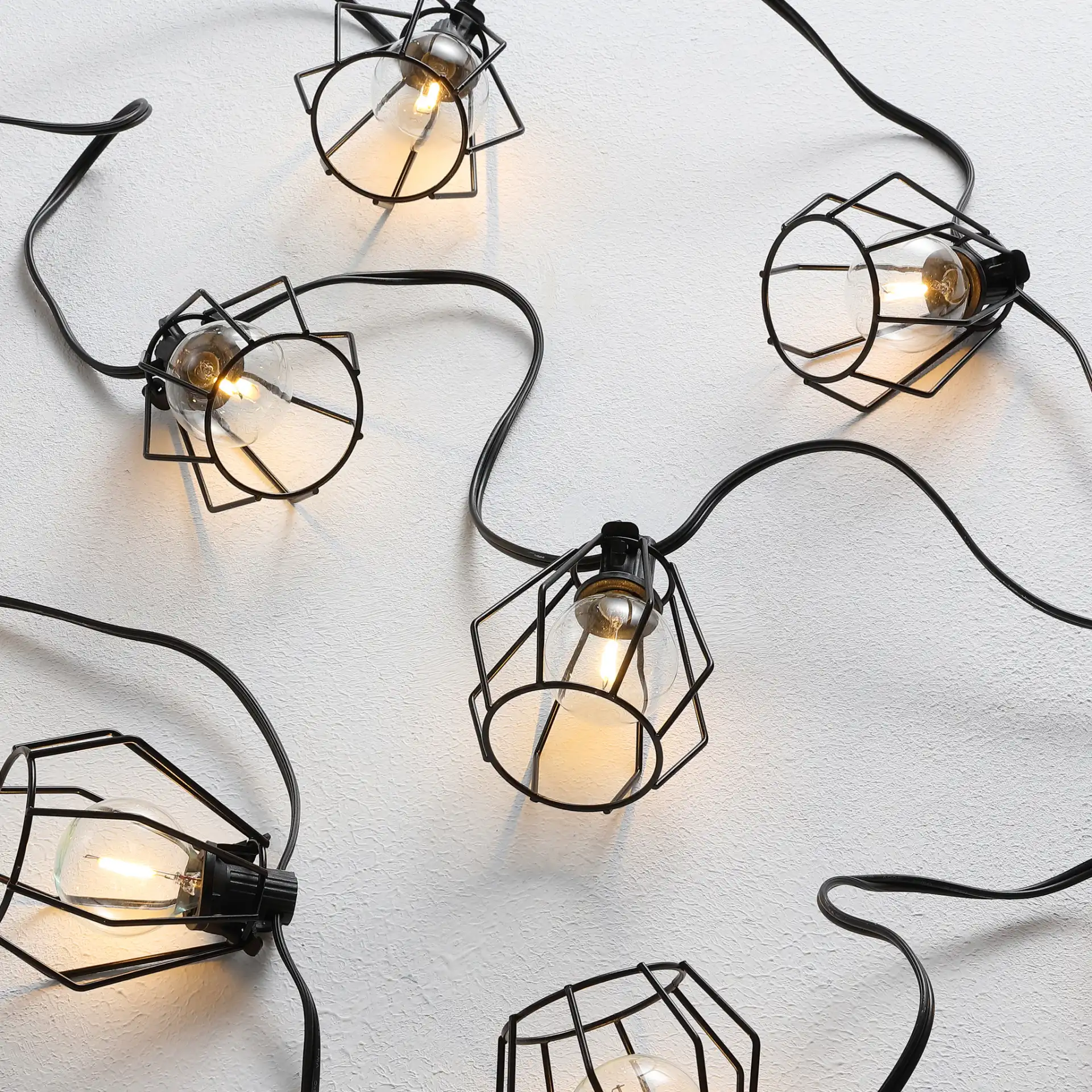 Bowne Led Outdoor String Light in Black in a styled room