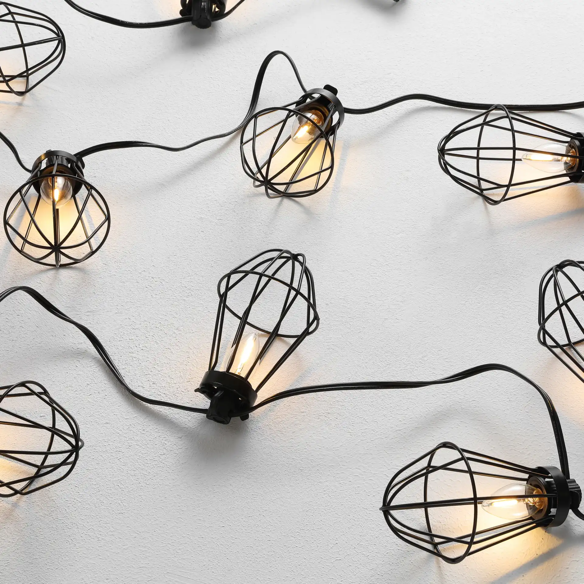 Ellina Led Outdoor String Light in Black in a styled room