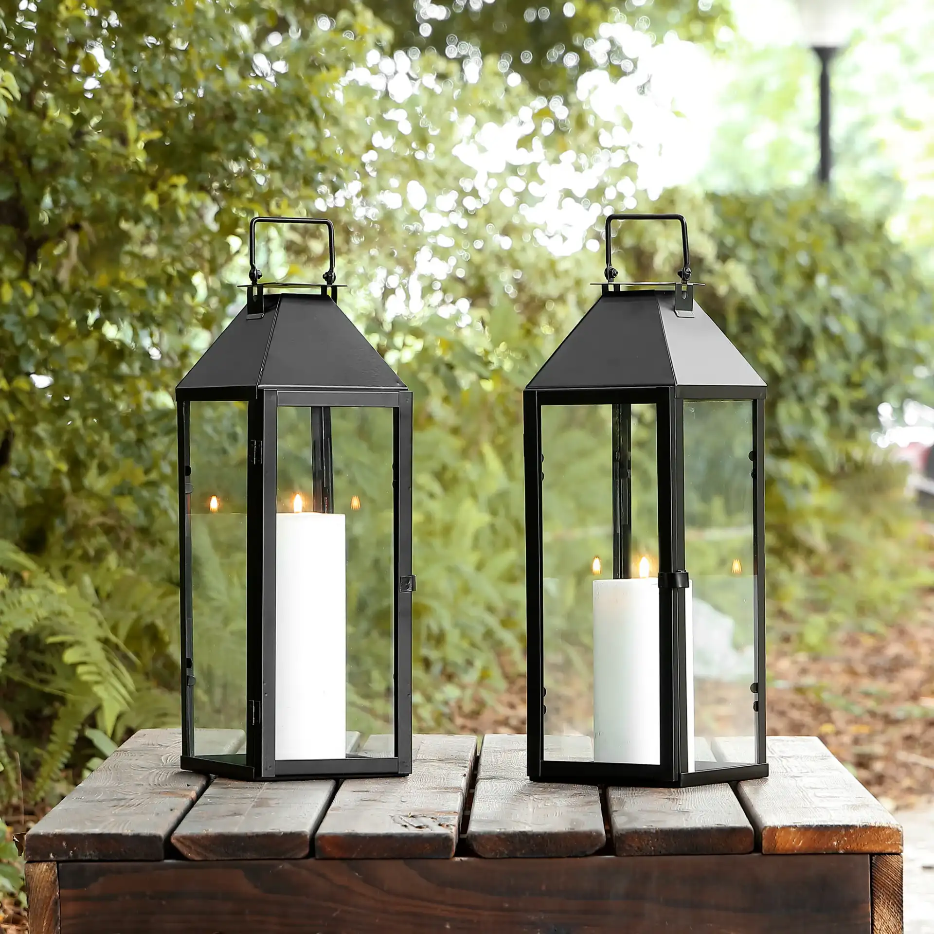 Ruane Outdoor Lantern (Set of 2) in Black in a styled room