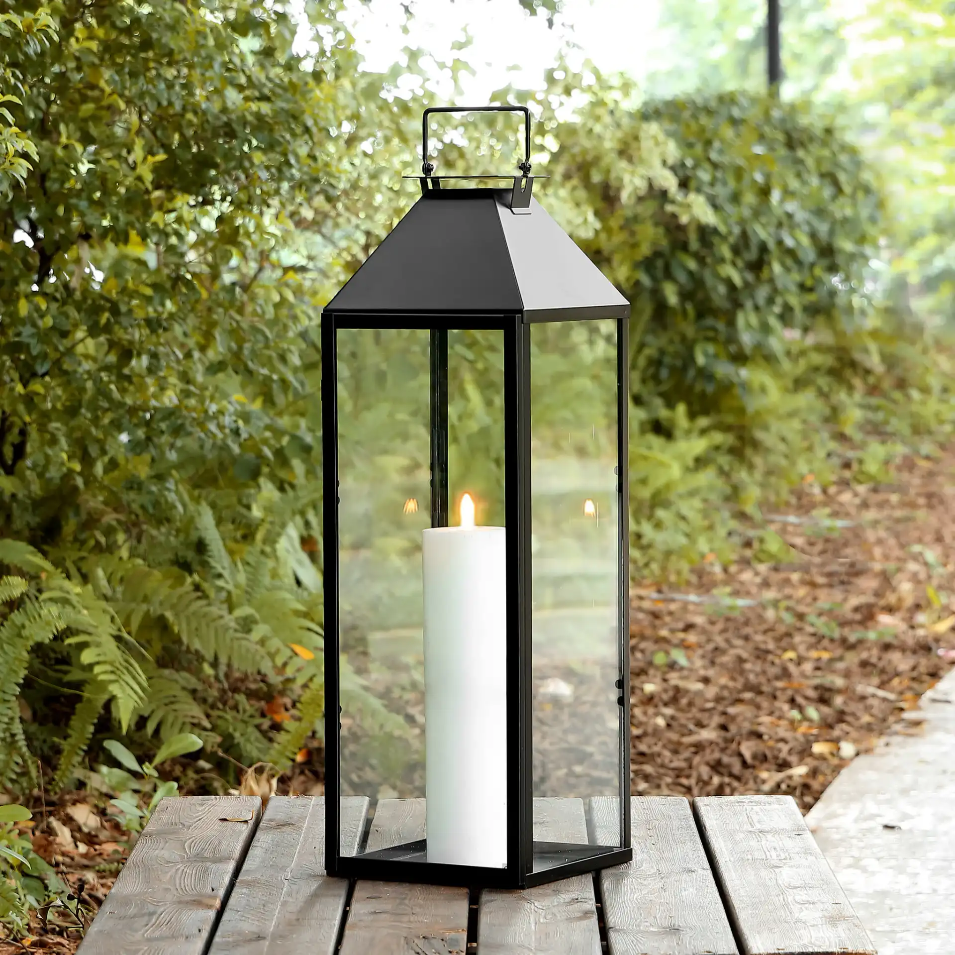 Ruane Outdoor Lantern in Black in a styled room
