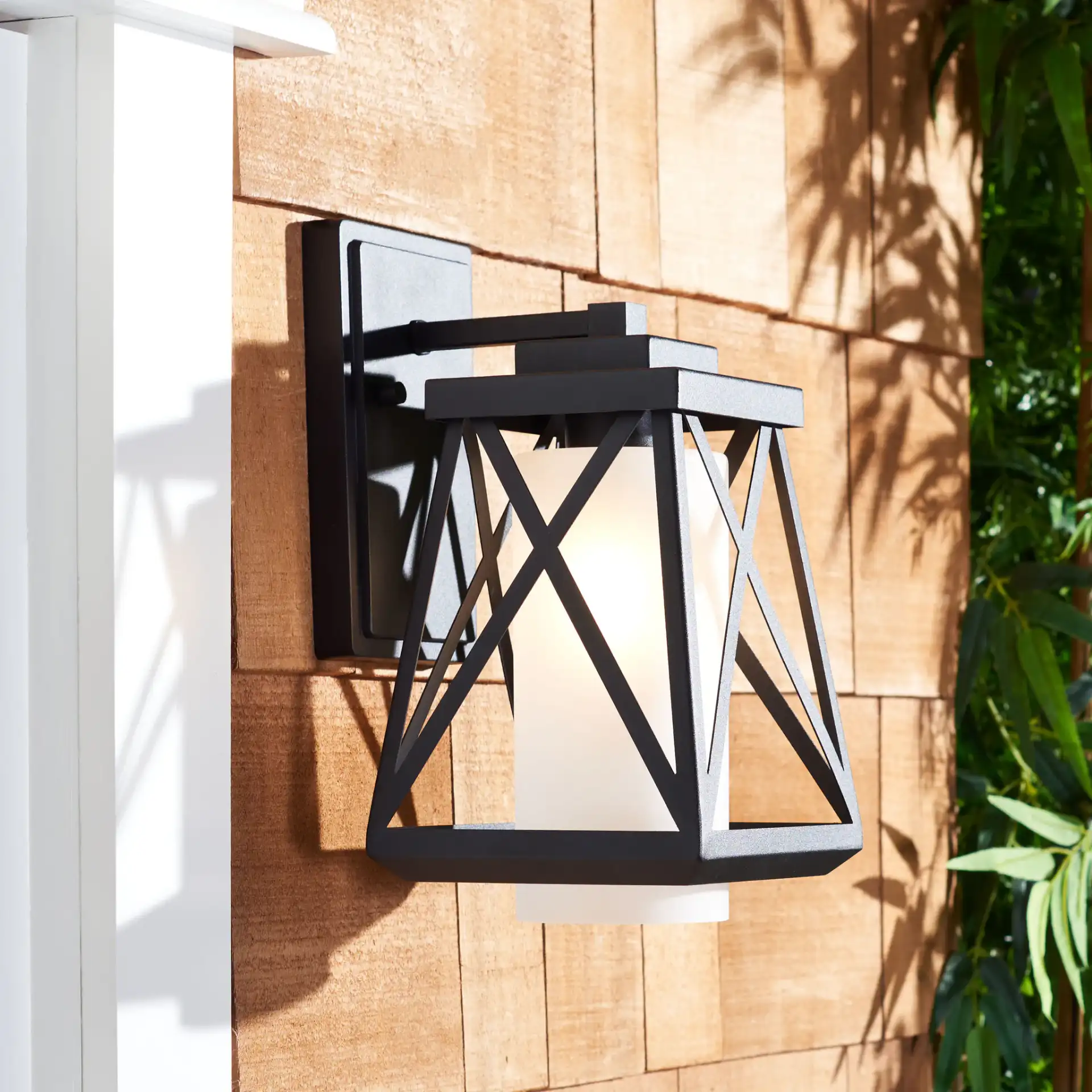 Braith Outdoor Wall Sconce (Set of 2) in Black in a styled room