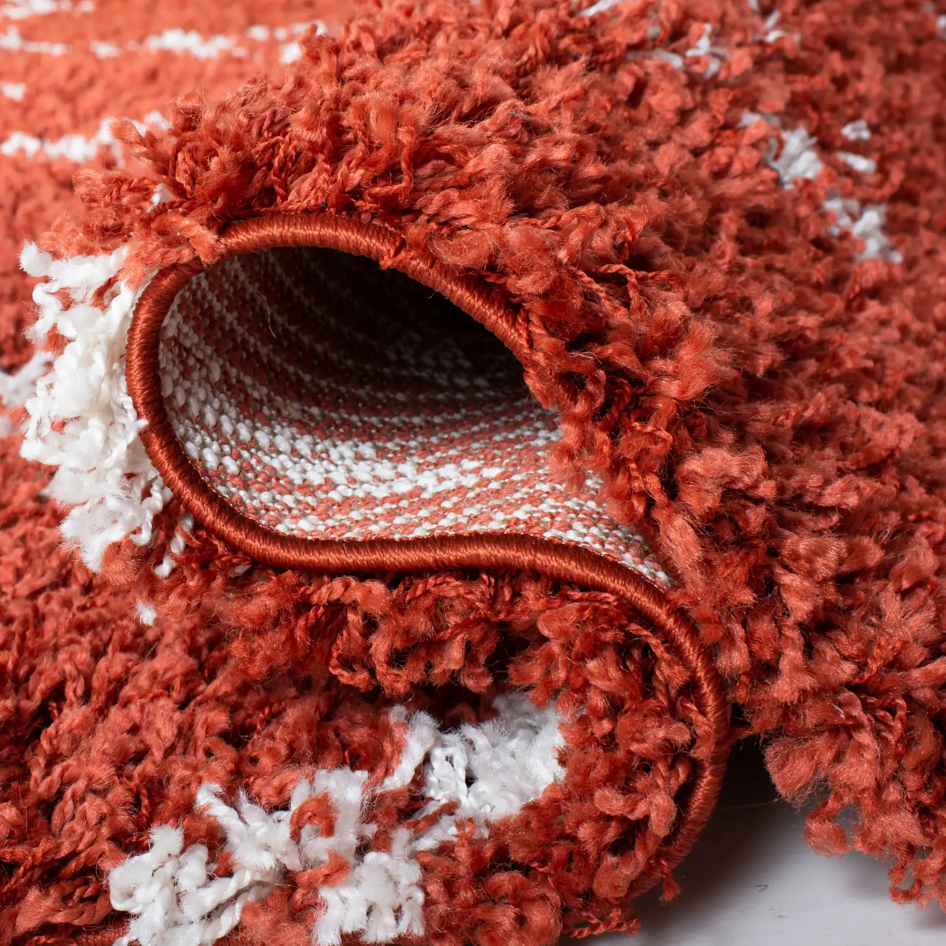 Pro Lux Diamond Lattice Shag Rug in Rust / Cream in a styled room