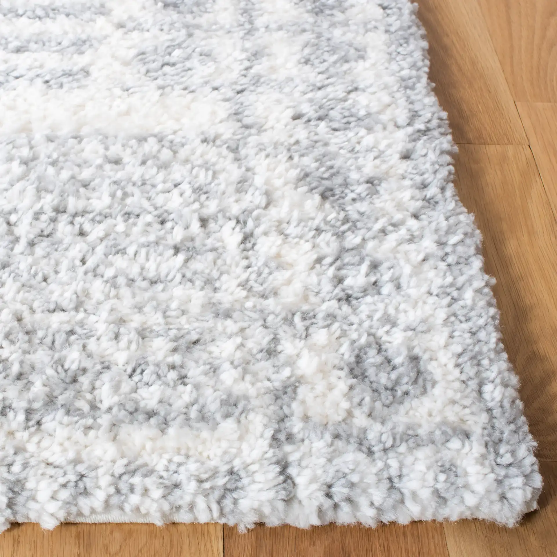 Parma Striped Border Shag Rug in Gray / Ivory in a styled room