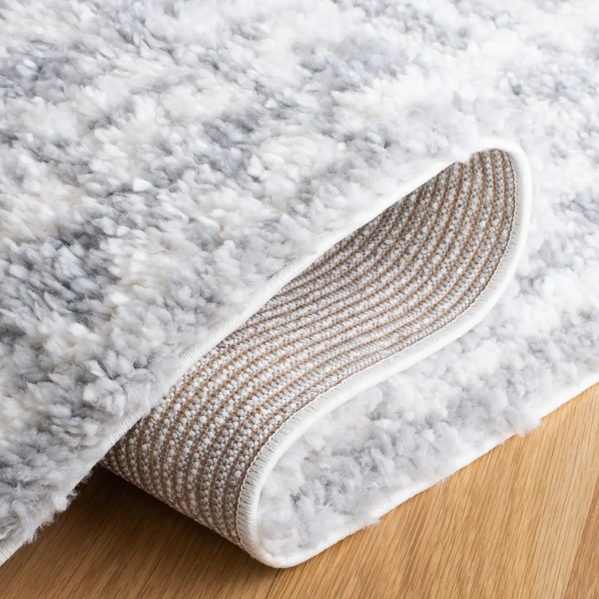 Parma Striped Border Shag Rug in Gray / Ivory in a styled room