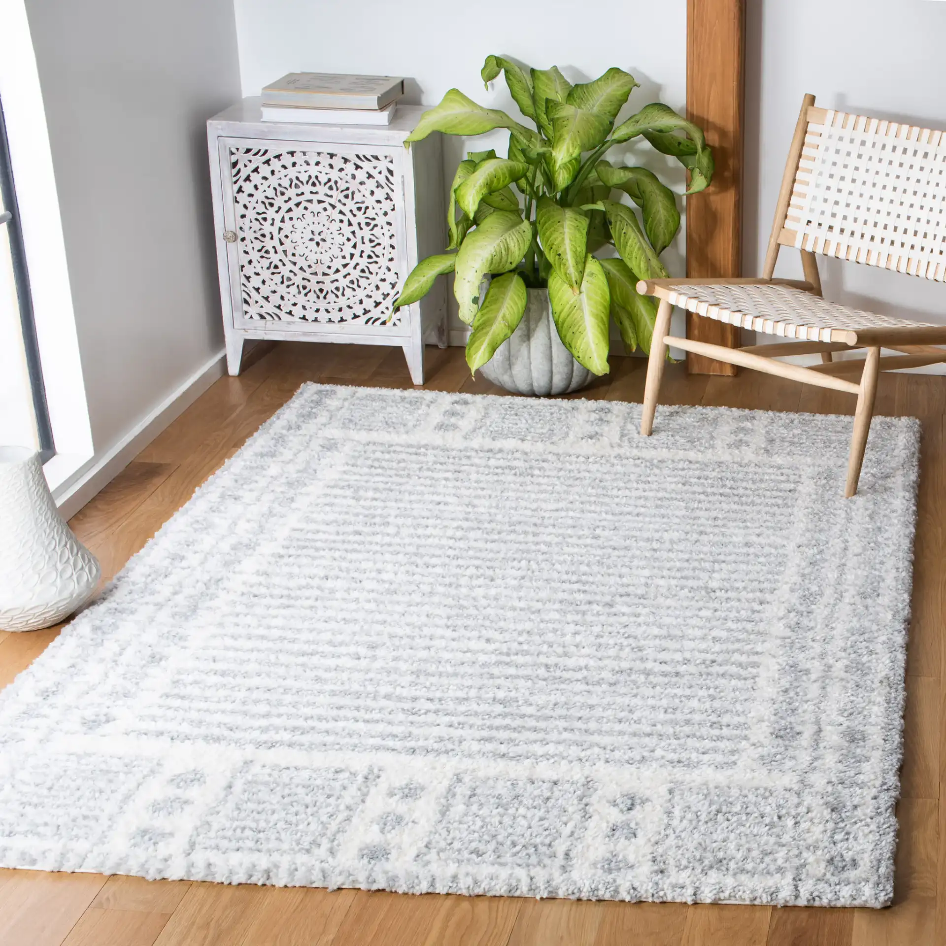 Parma Striped Border Shag Rug in Gray / Ivory in a styled room