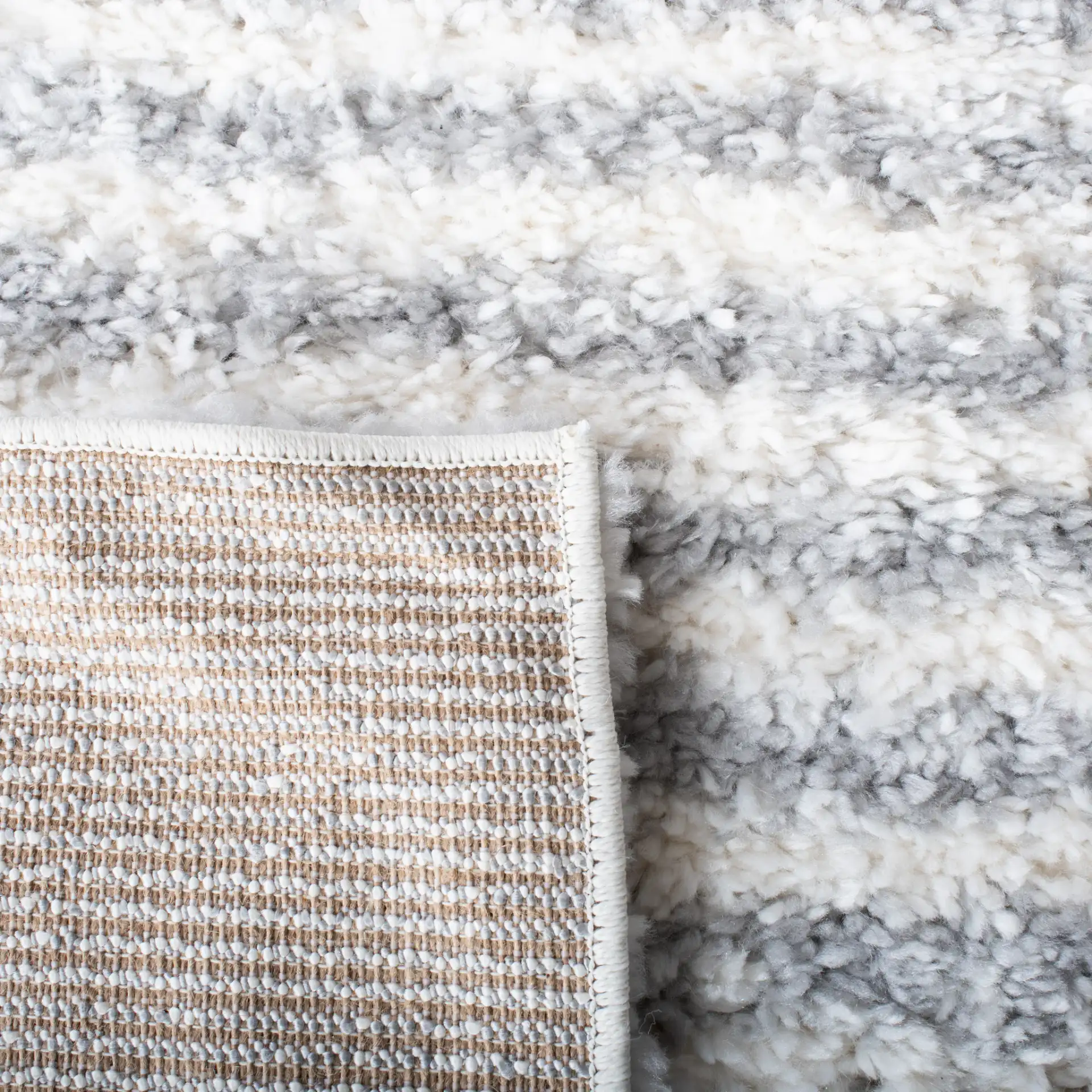 Parma Striped Border Shag Rug in Gray / Ivory in a styled room