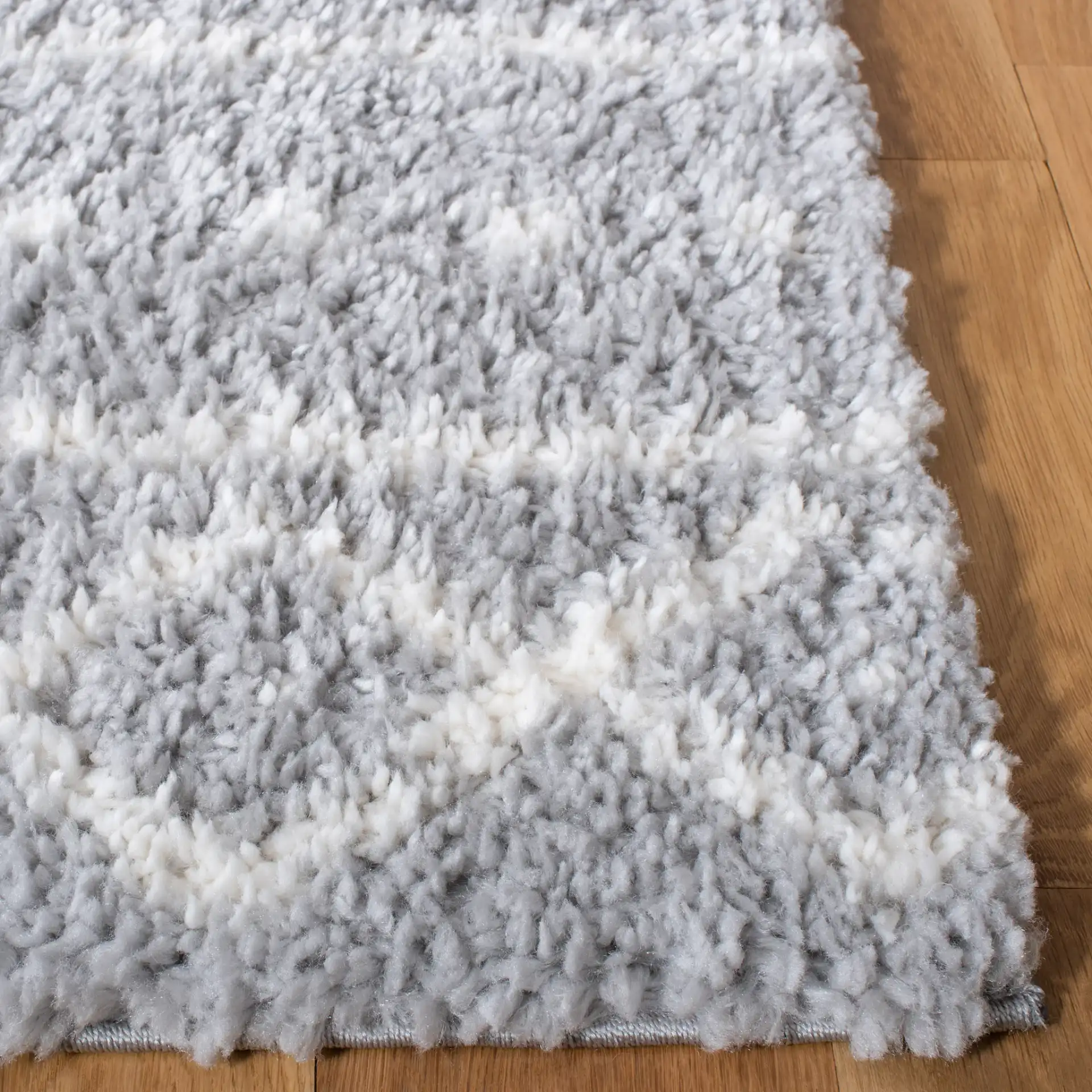 Parma Banded Moroccan Shag Rug in Gray / Ivory in a styled room