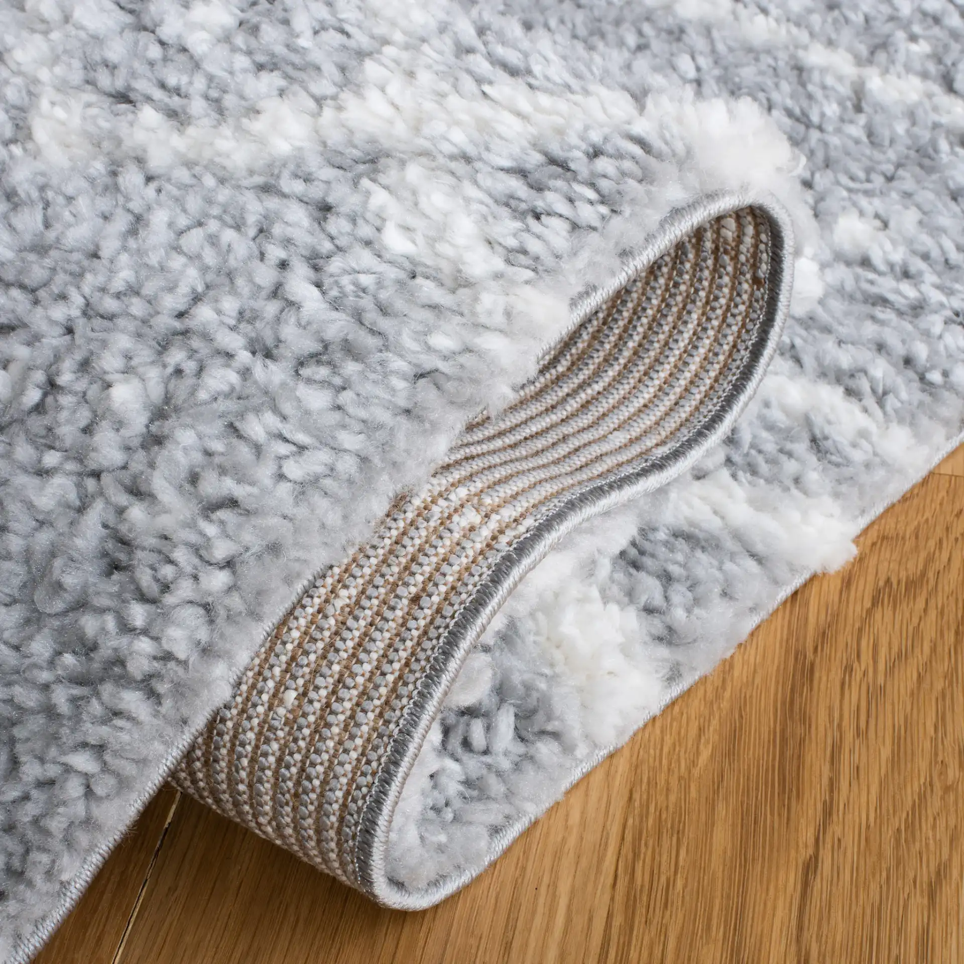 Parma Banded Moroccan Shag Rug in Gray / Ivory in a styled room