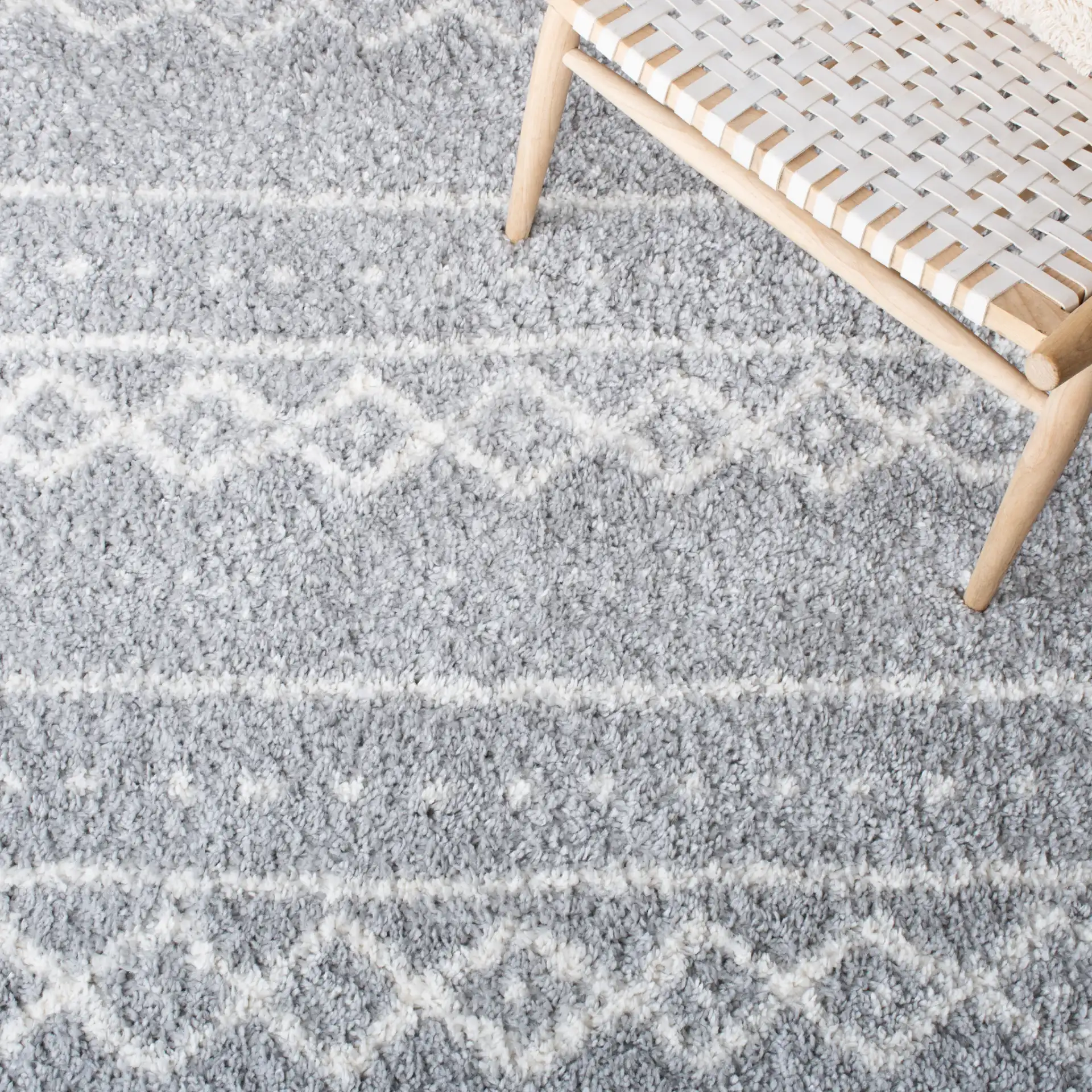 Parma Banded Moroccan Shag Rug in Gray / Ivory in a styled room