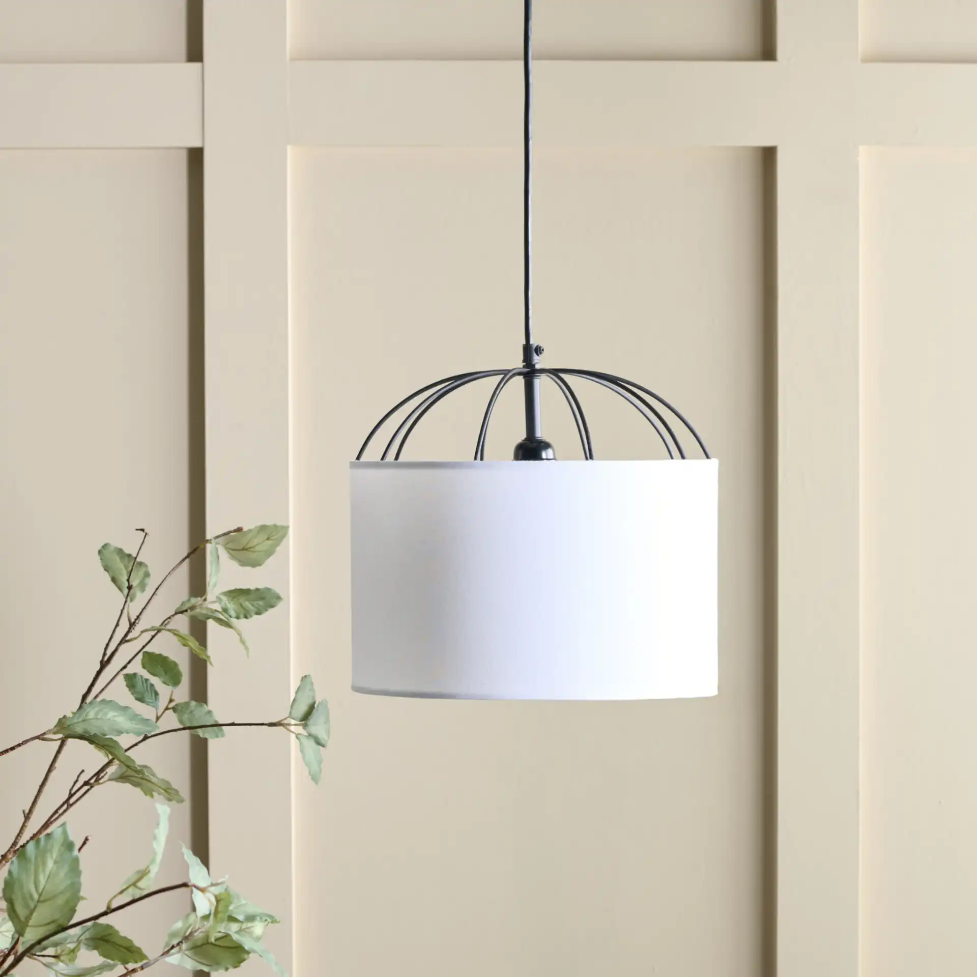 Noomi Pendant in White / Black in a styled room