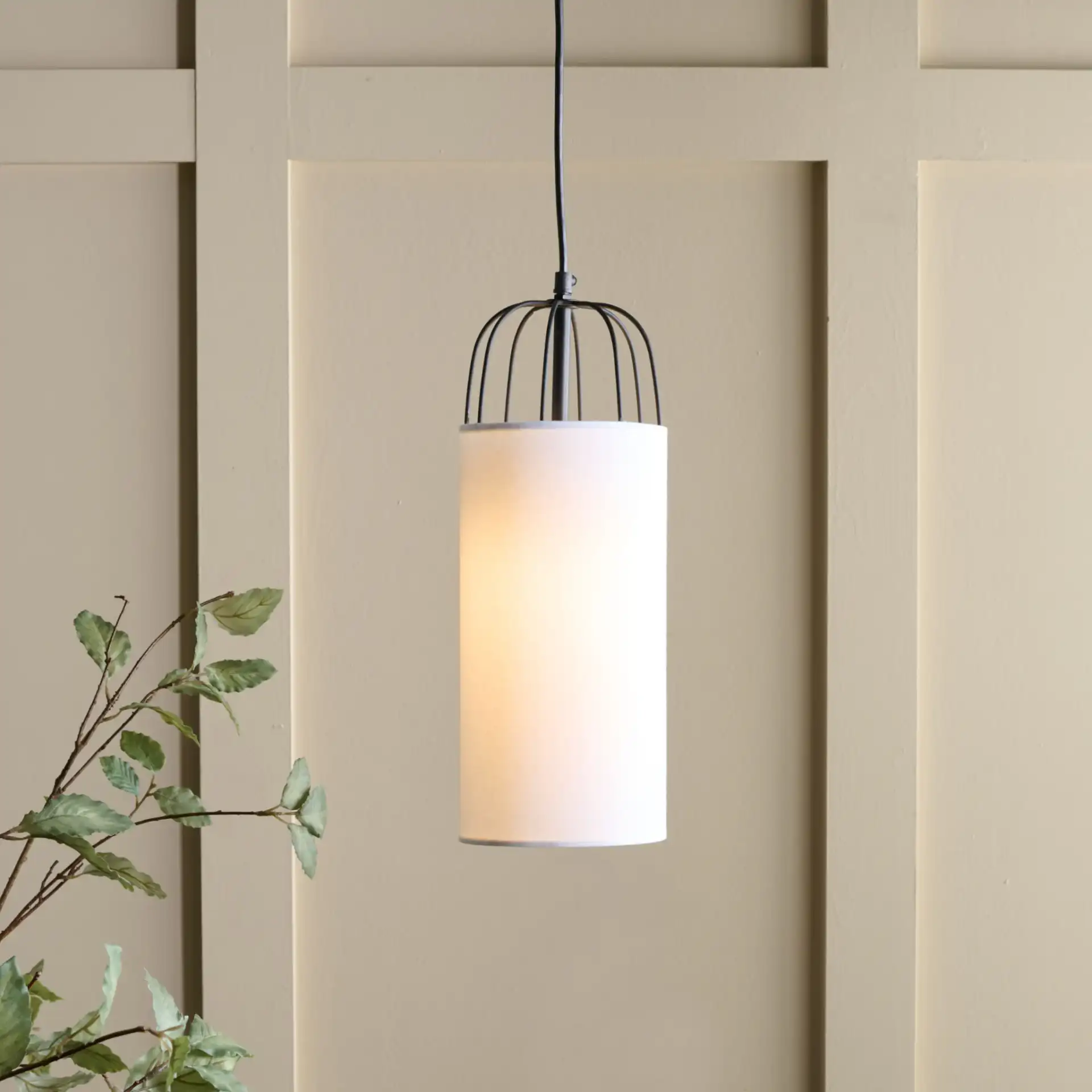 Navi Pendant in White / Black in a styled room