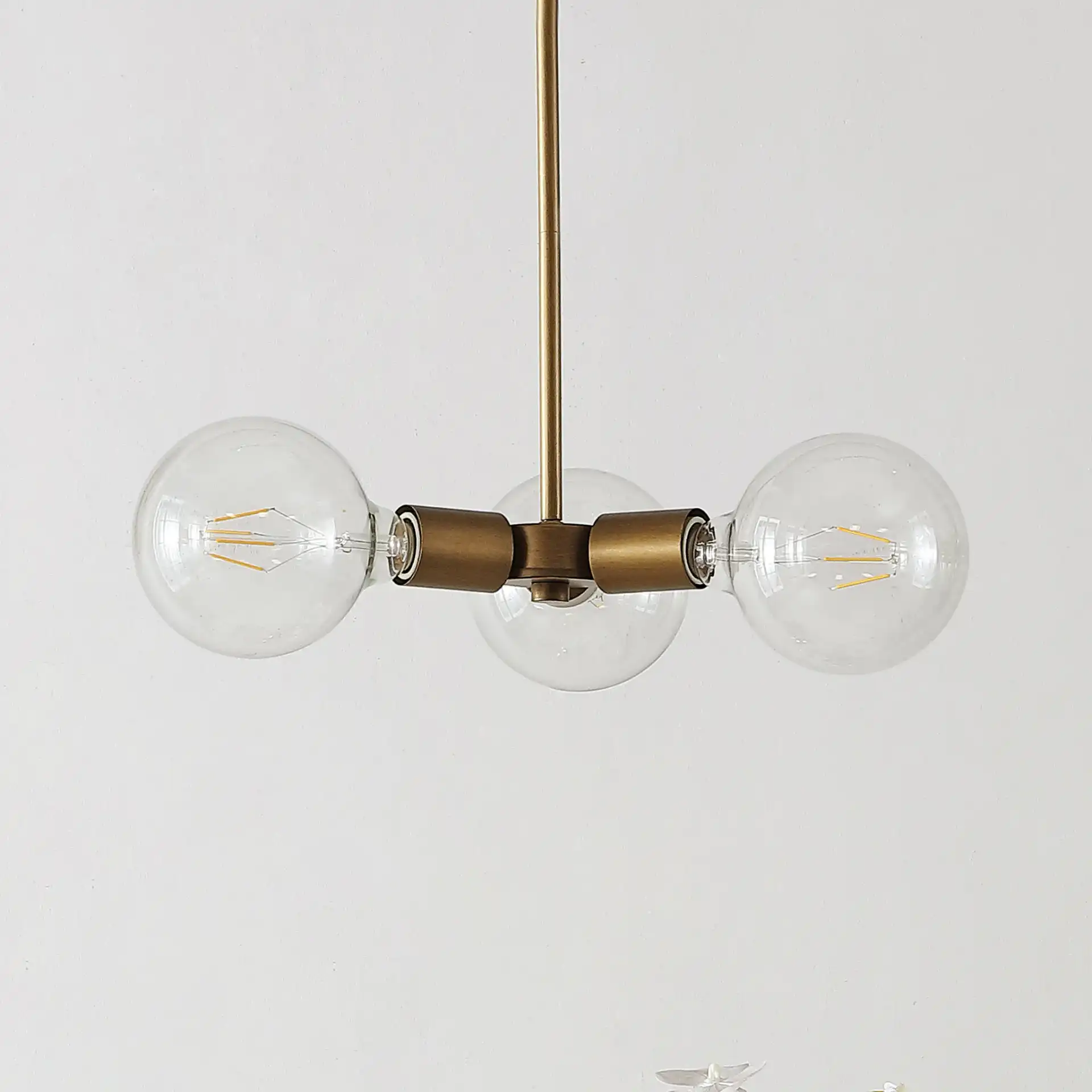 Harkin Three-Light Pendant in Gold, detail view