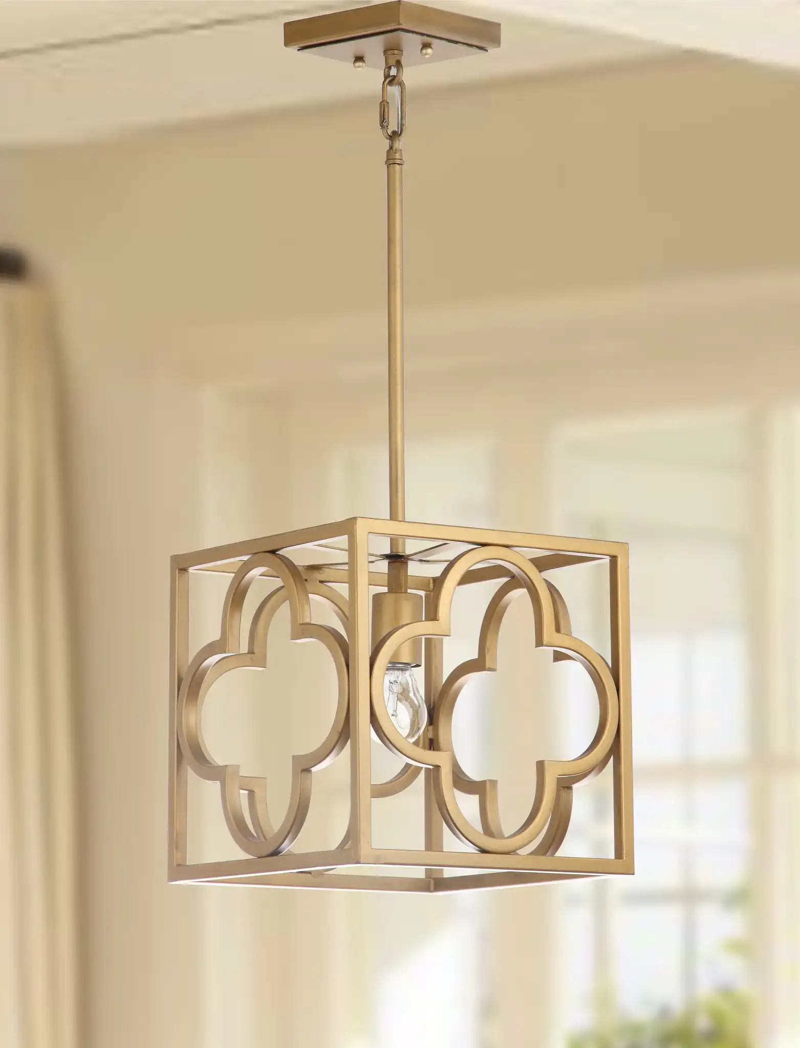 Rabia Pendant in Gold in a styled room