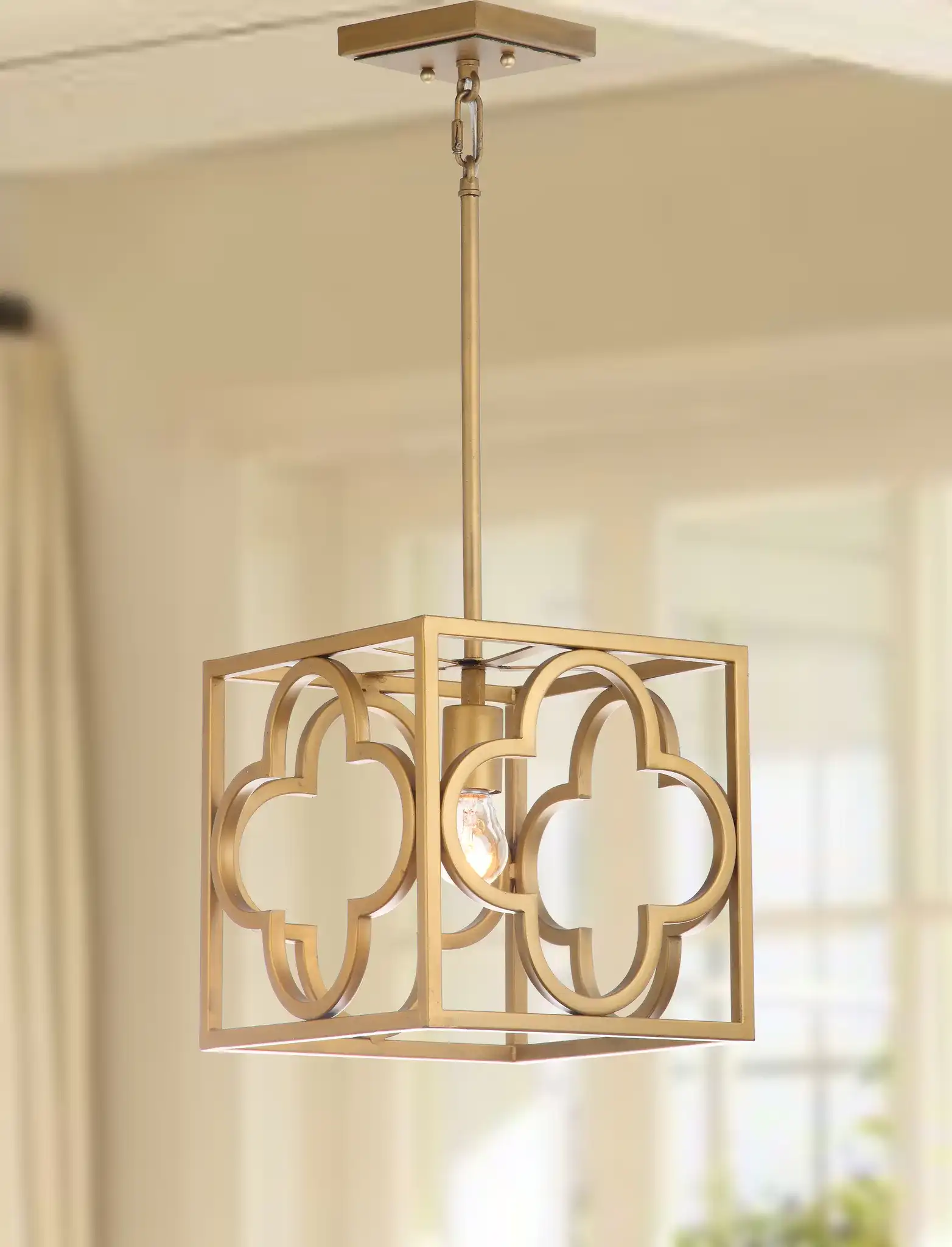 Rabia Pendant in Gold in a styled room