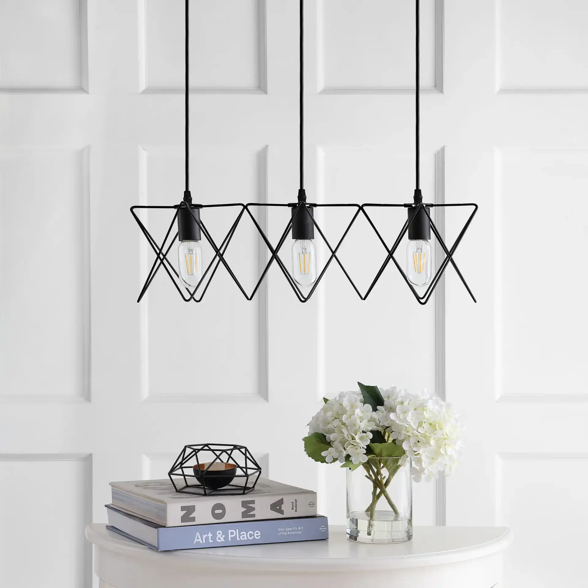 Pernille Three-Light Pendant in Black in a styled room