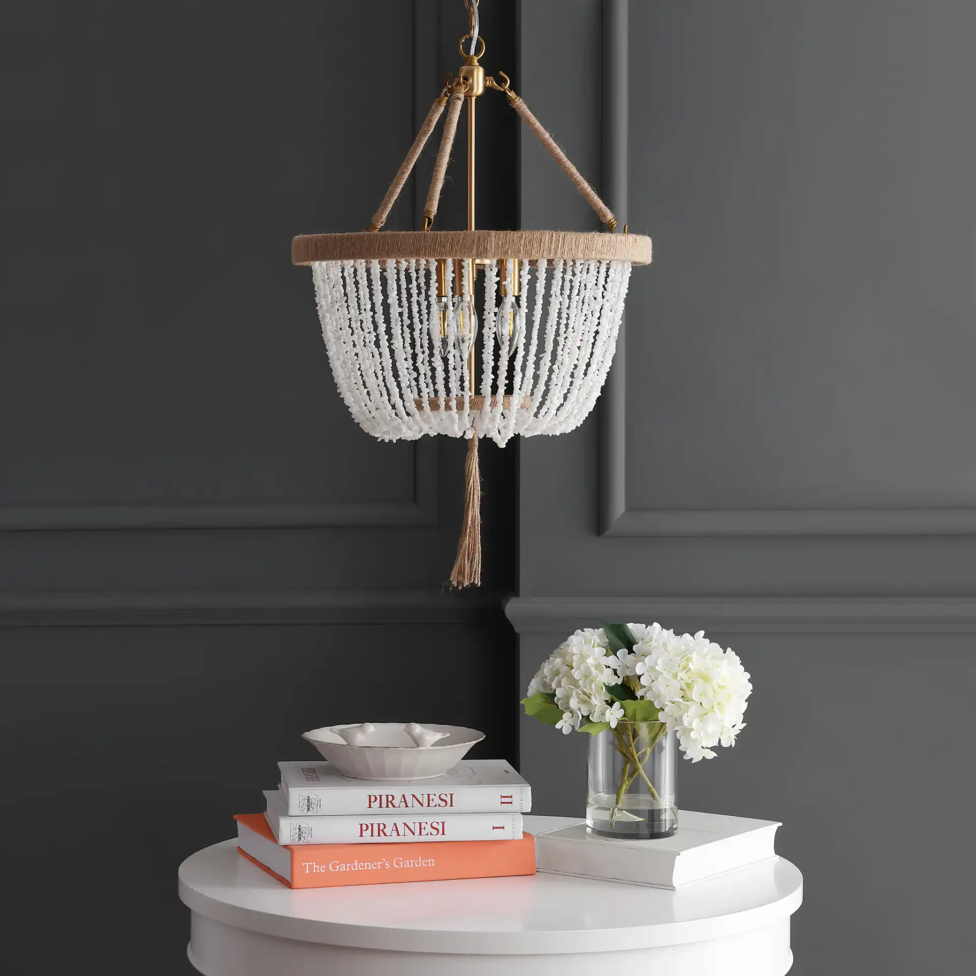 Cydney Three-Light Pendant in Brass Gold / White in a styled room