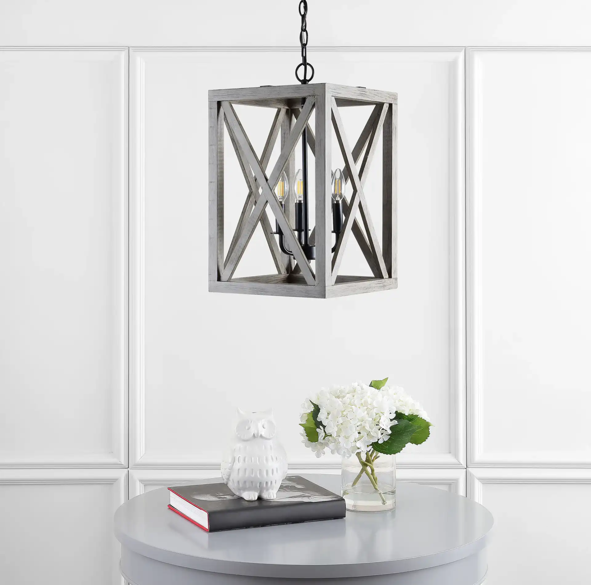 Rabea Three-Light Pendant in Black in a styled room