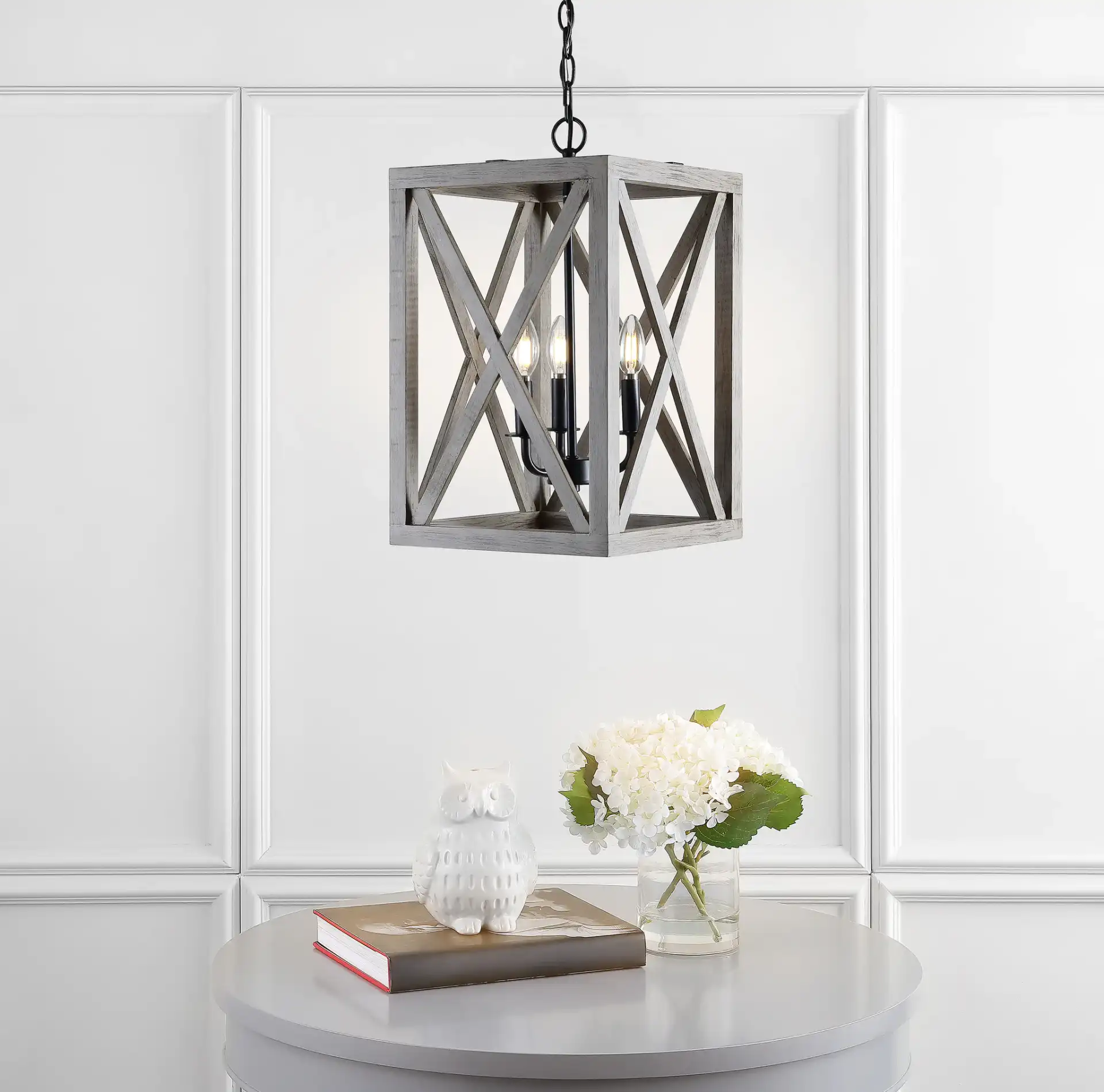 Rabea Three-Light Pendant in Black in a styled room