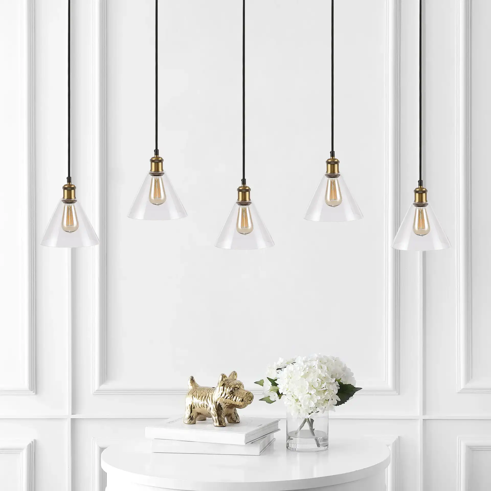 Presta Five-Light Pendant in Black / Gold in a styled room