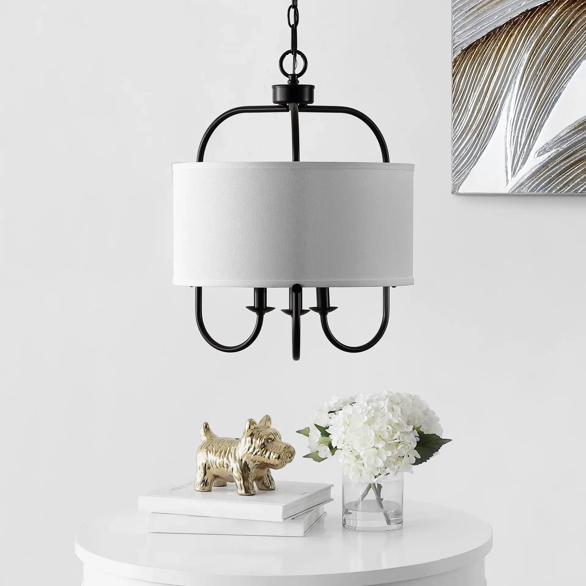 Jemmi Three-Light Pendant in Black in a styled room