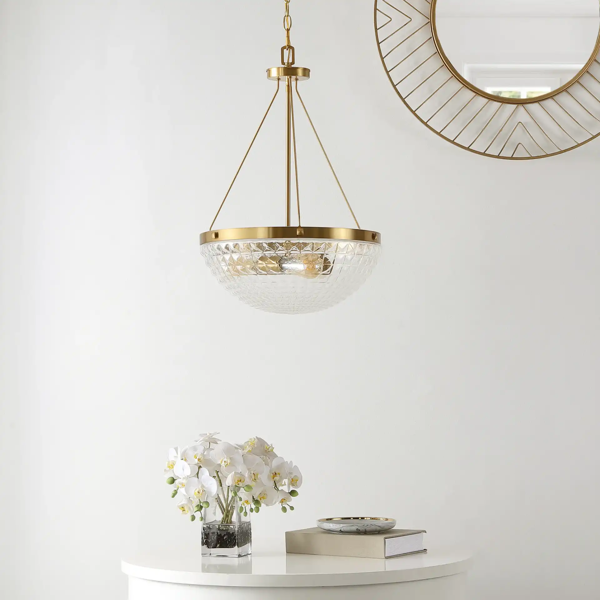 Thorin Three-Light Pendant in Brass in a styled room