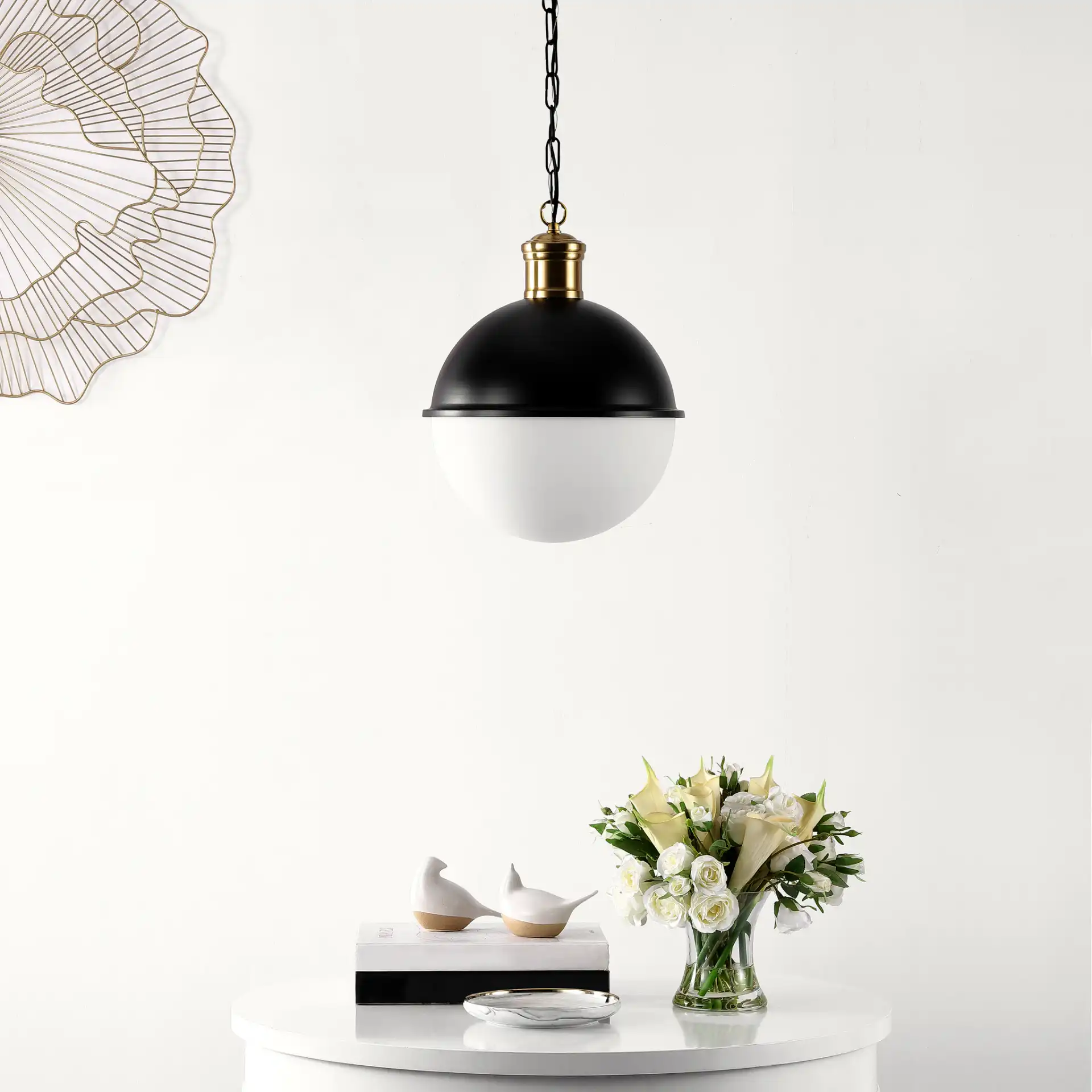 Daylily Pendant in Black / Brass in a styled room